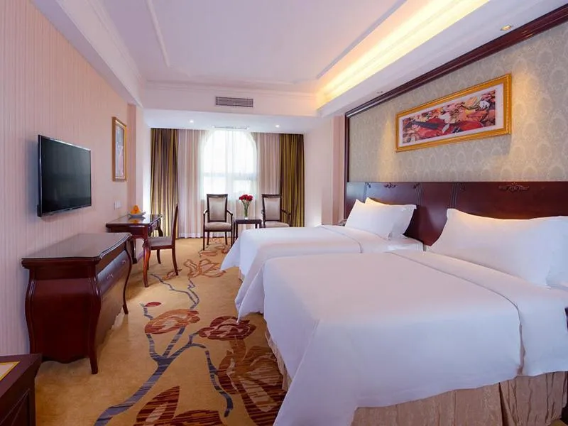 Bed in Vienna Hotel Guangzhou Shiling