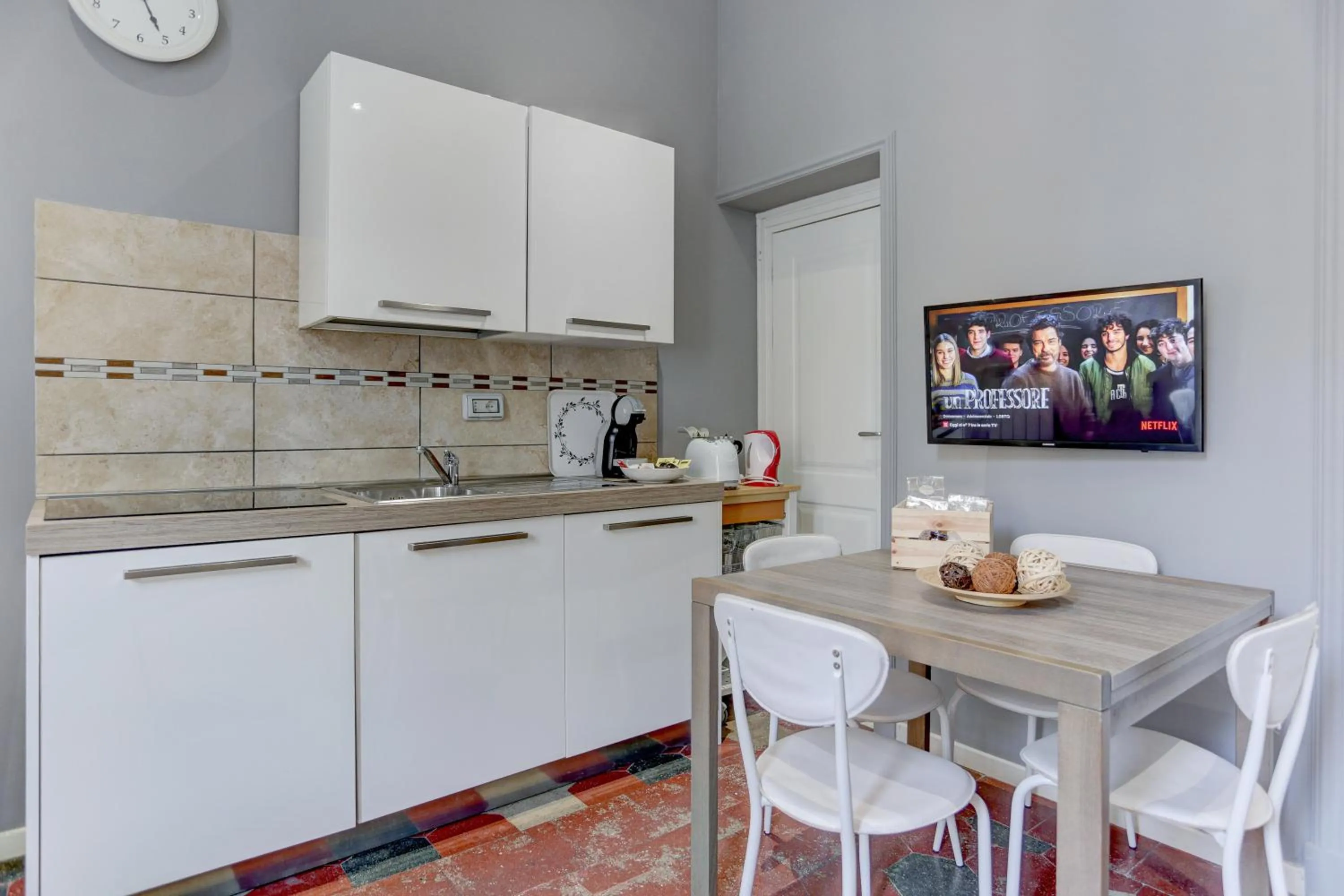 Kitchen or kitchenette in Appartamento Santi Quattro - Colosseo