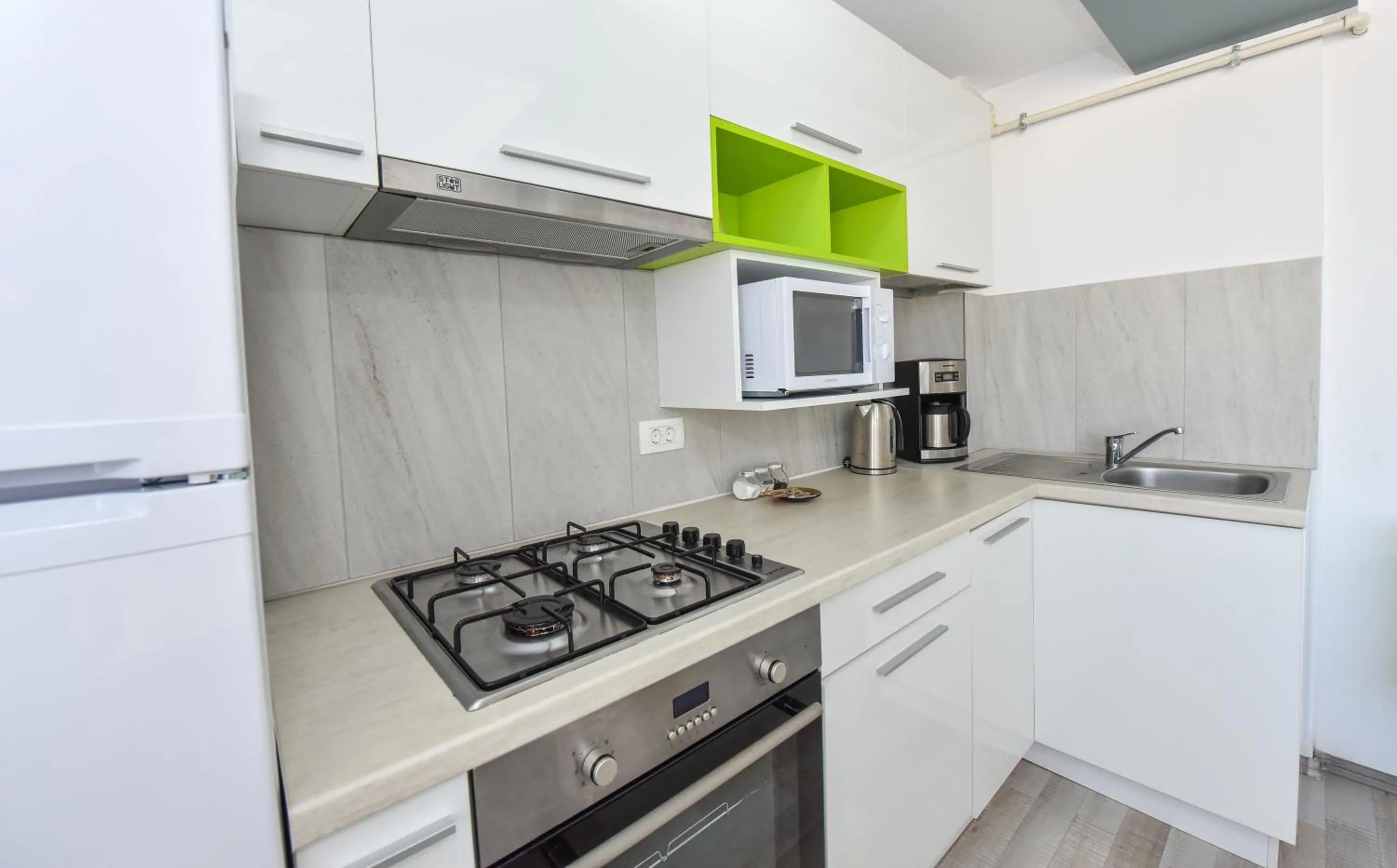 Kitchen or kitchenette in Harmony Suites