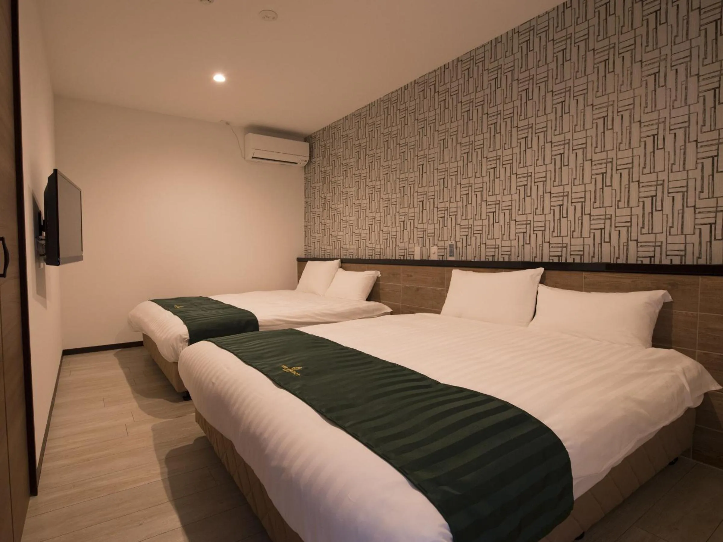 Bed in The Peridot Smart Hotel Tancha Ward