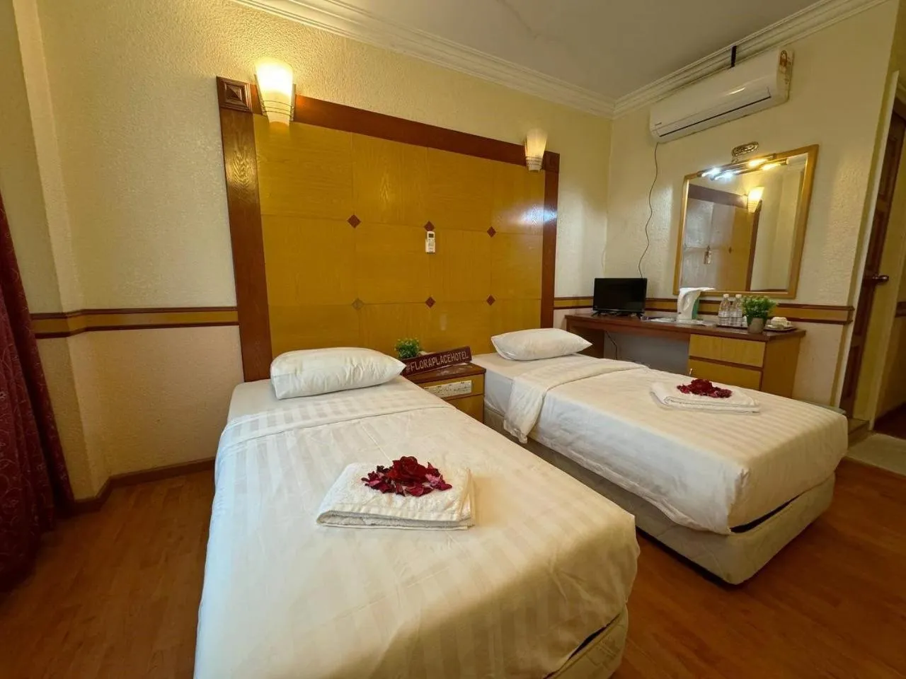 Bed in Flora Place Hotel