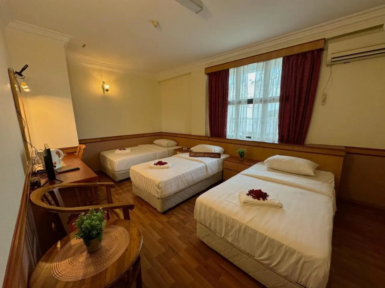 Bed in Flora Place Hotel