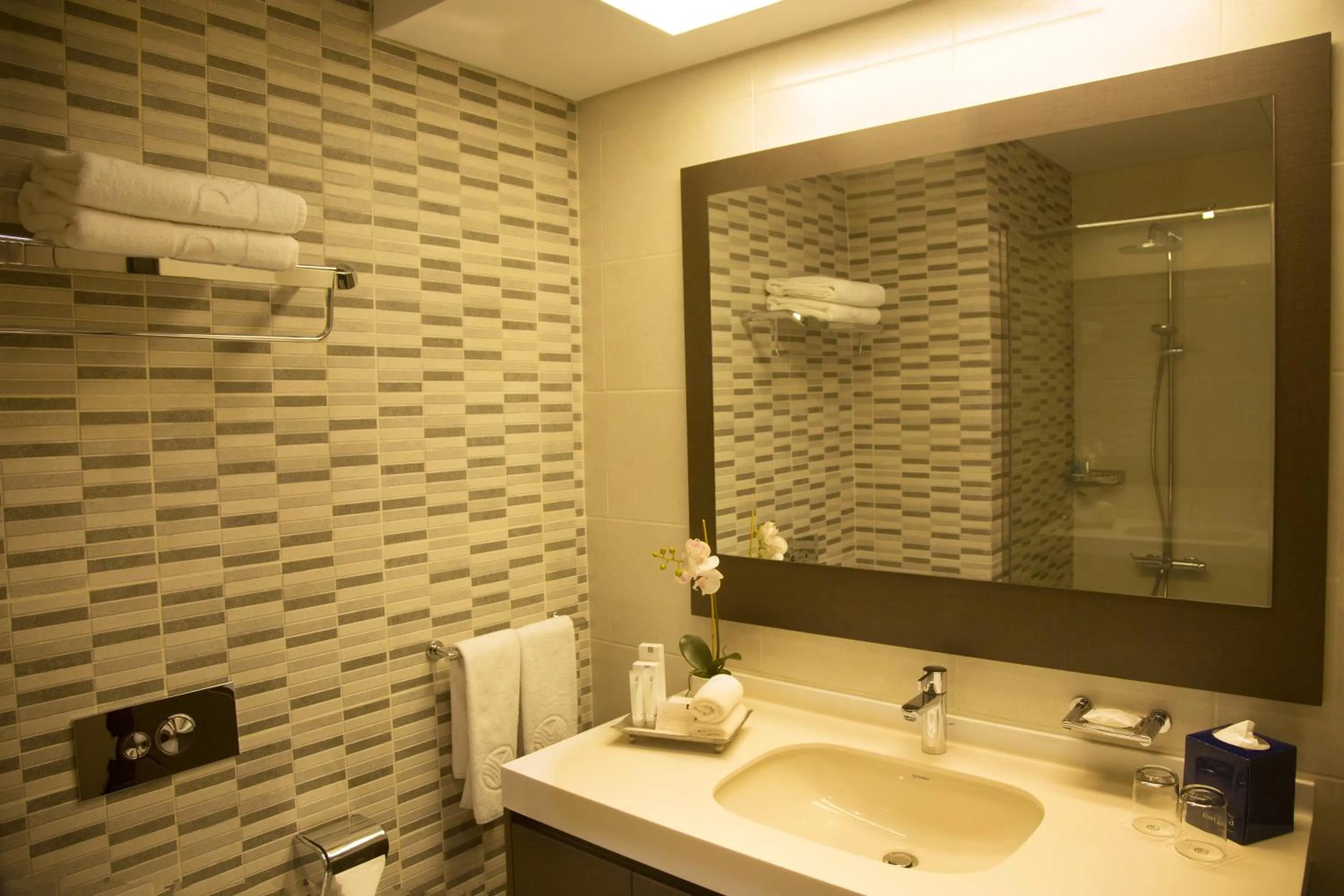 Bathroom in Kin Plaza Arjaan by Rotana