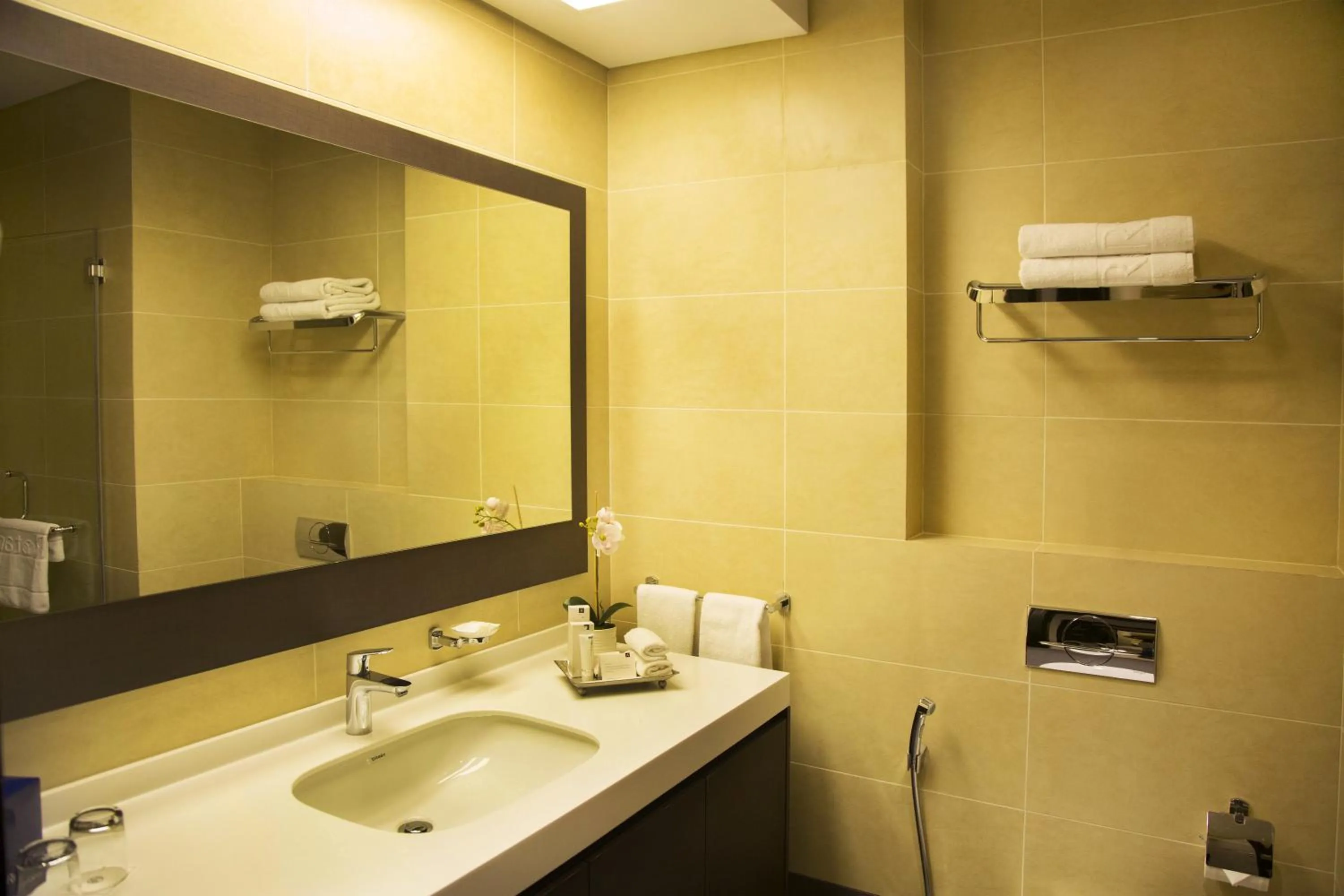 Bathroom in Kin Plaza Arjaan by Rotana