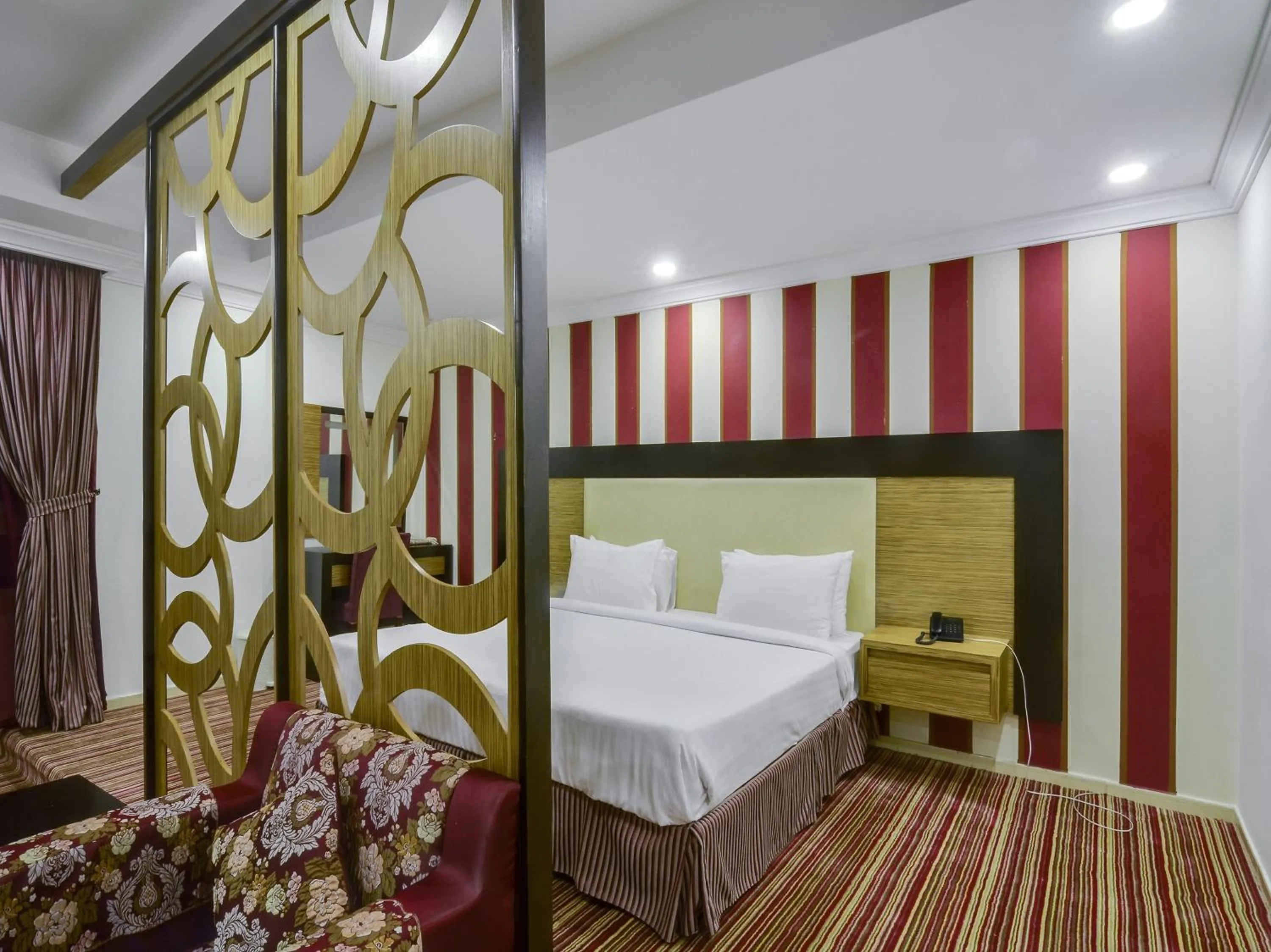 Seating area, Bed in Elaf Suites Al-Andalus