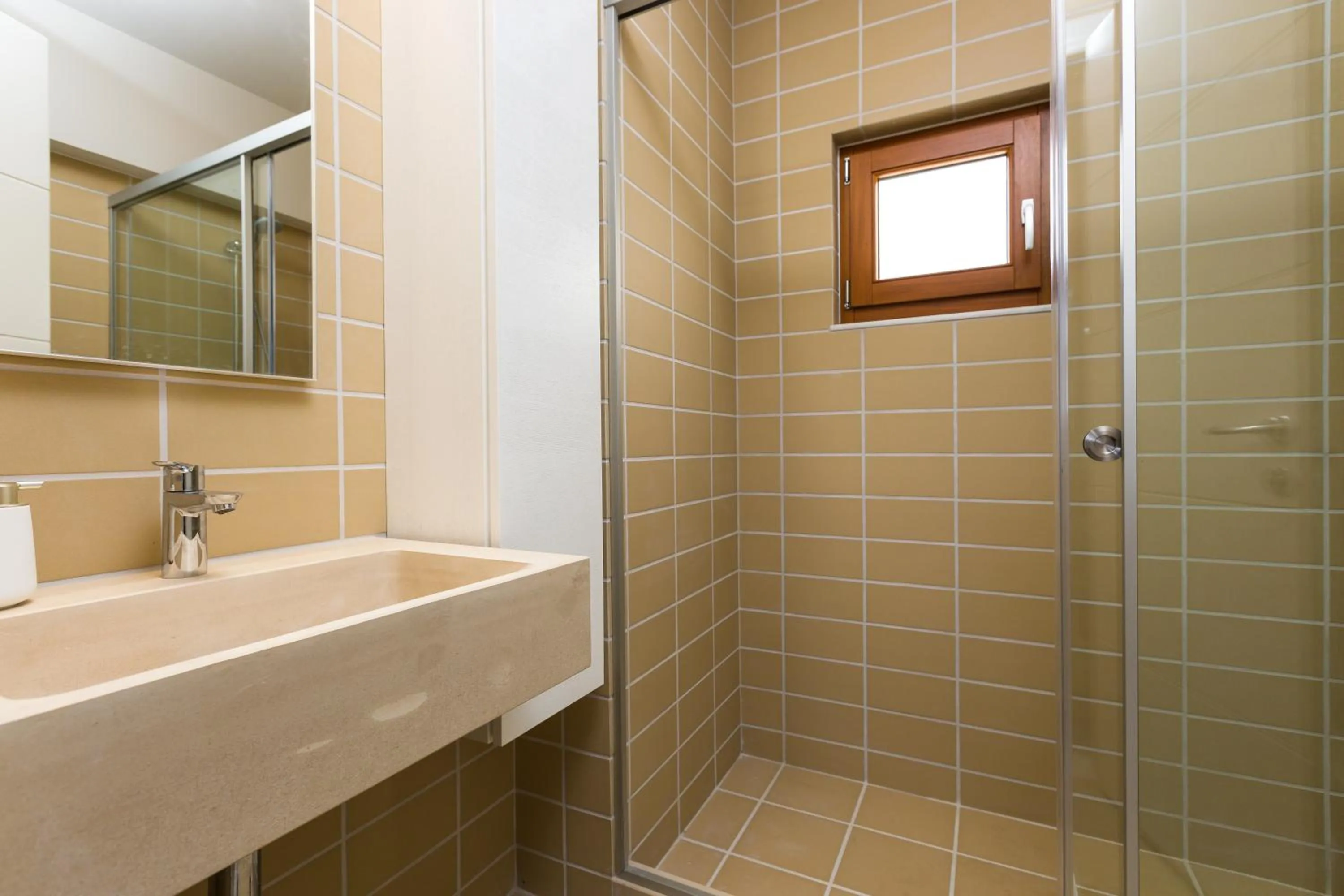 Bathroom in Mikro Livadi Special Lodges - Has an Eco Salt water pool - 150m from the beach