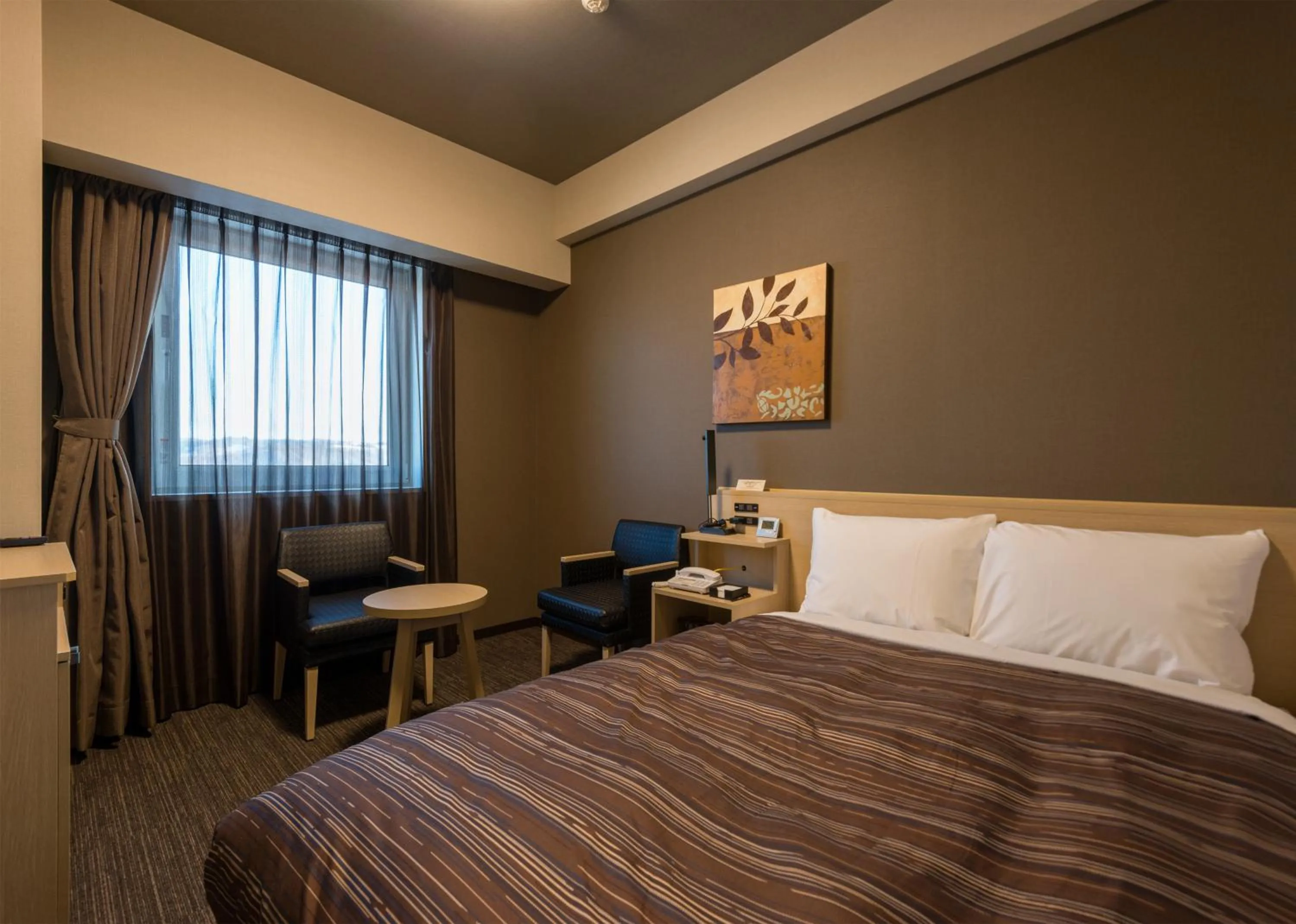 Bed in Hotel Route Inn Grand Kitami Ekimae