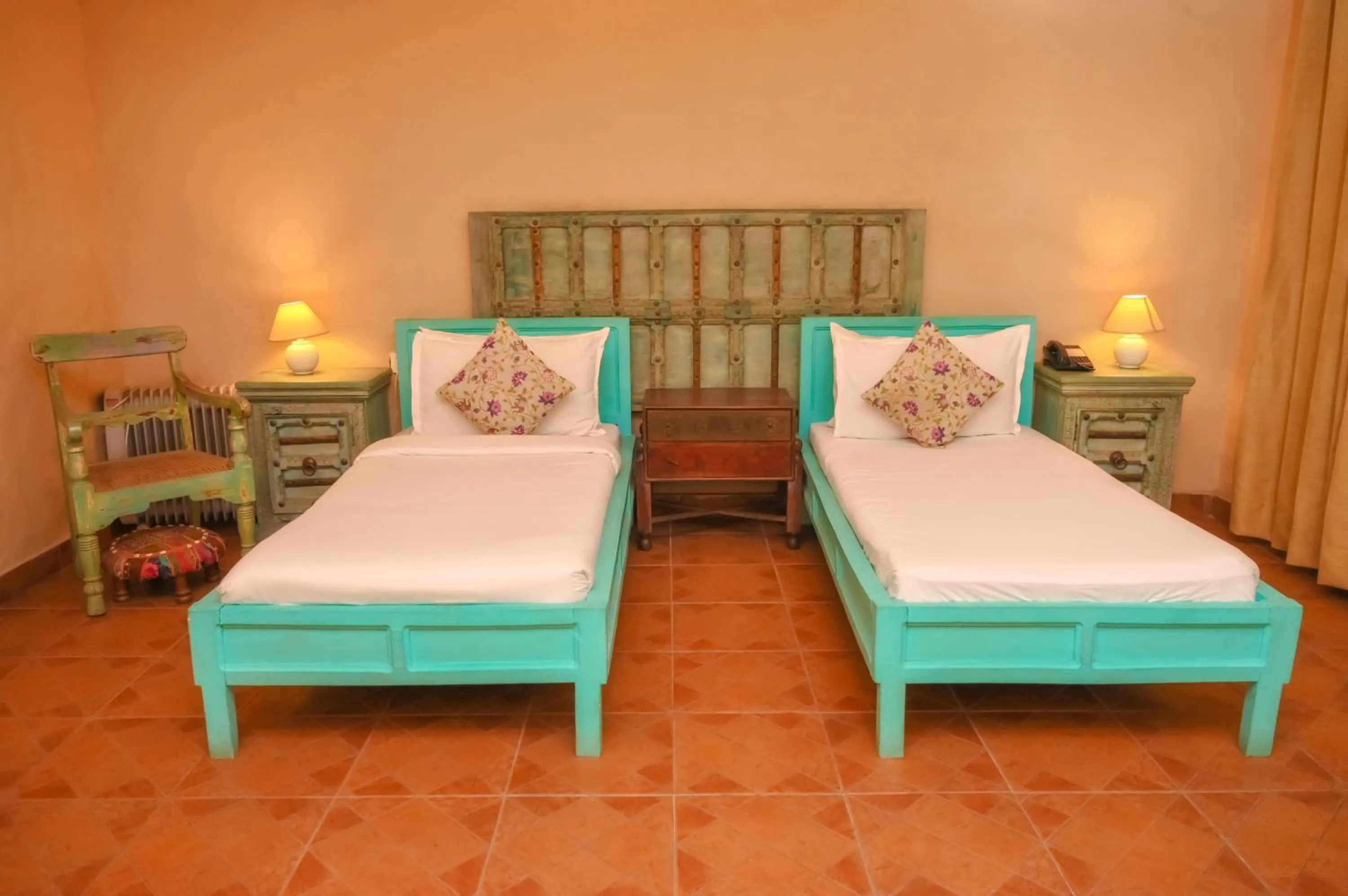 Bed in WelcomHeritage Ranjitvilas