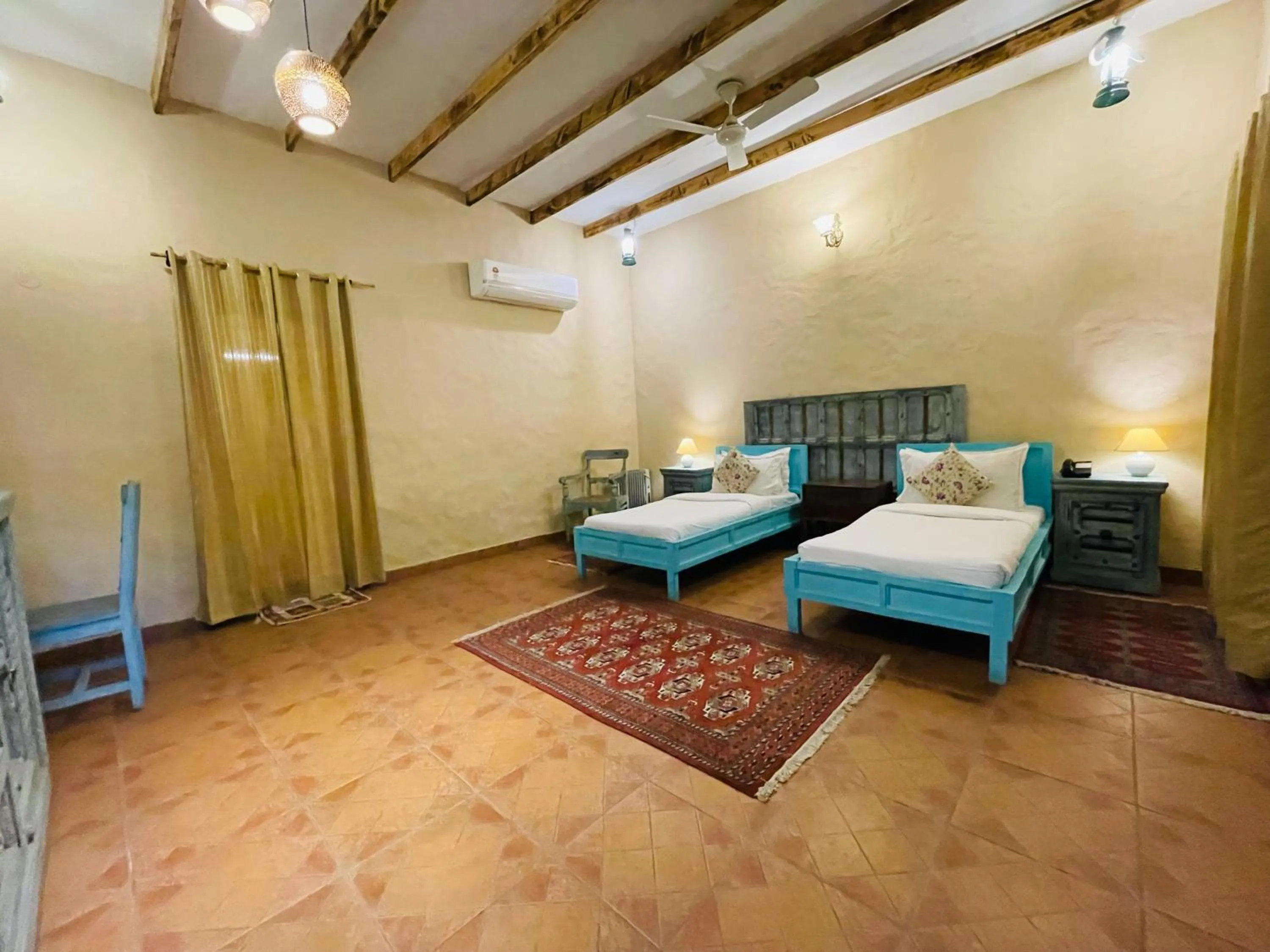 Bed in WelcomHeritage Ranjitvilas