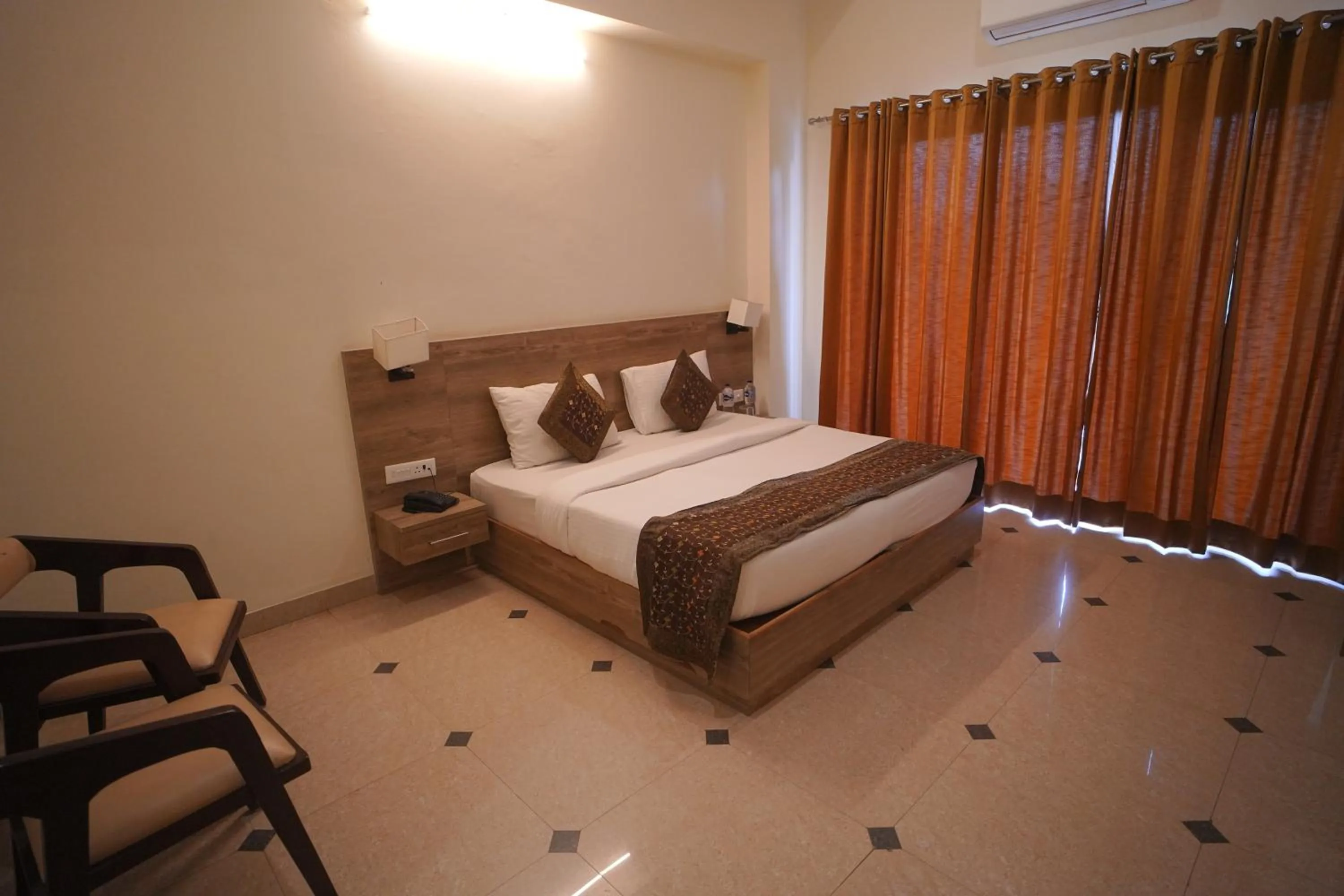 Bed in Dhawala Resort By Aamod