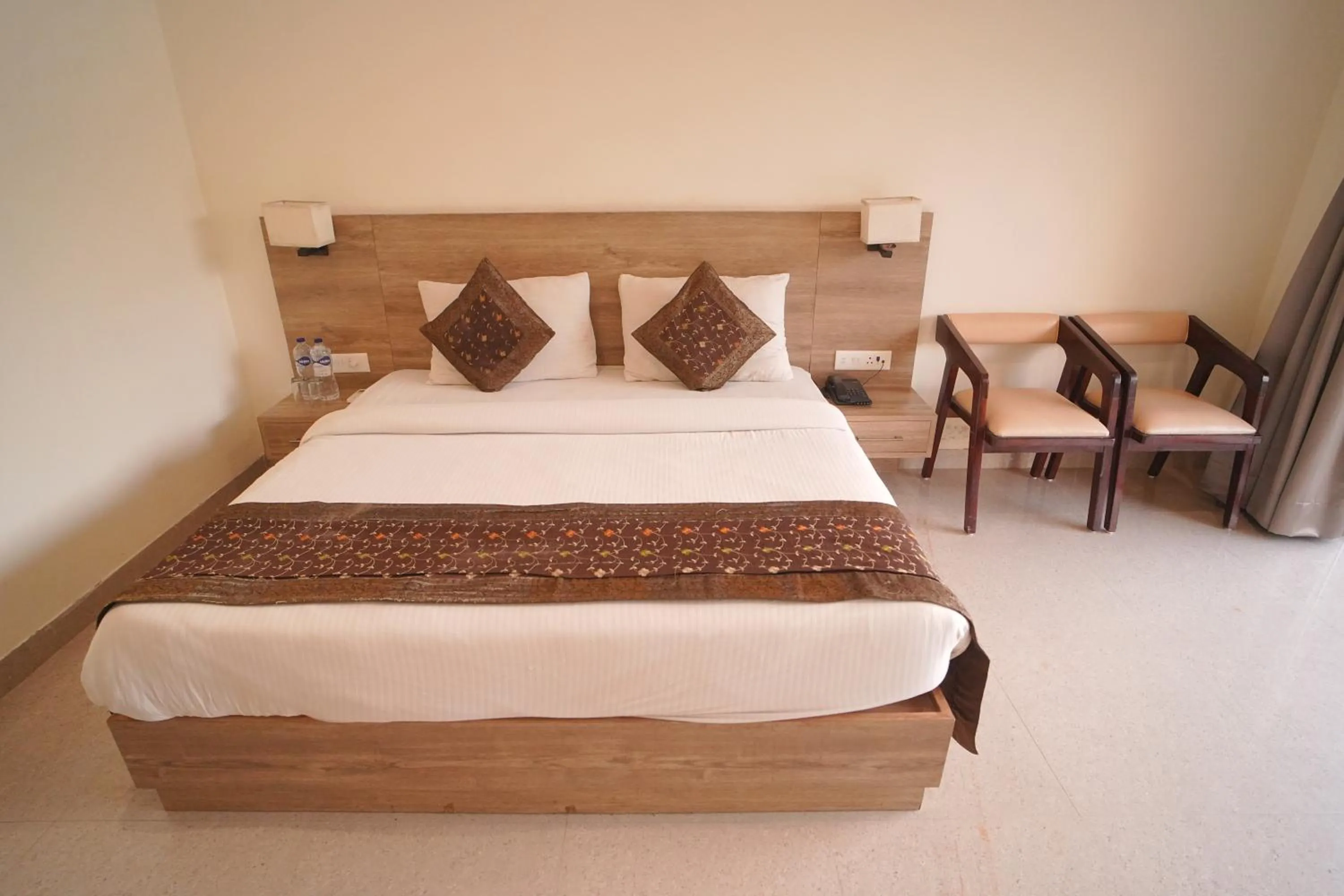Bed in Dhawala Resort By Aamod