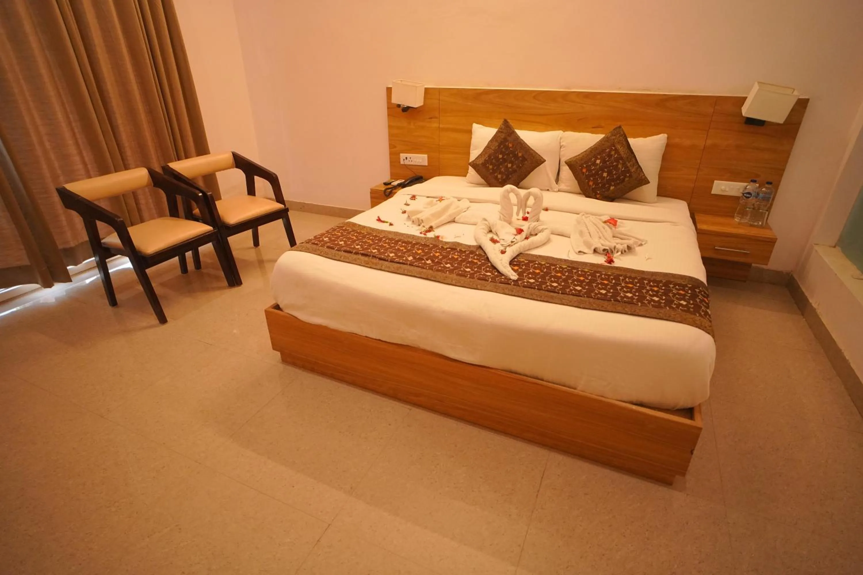 Bed in Dhawala Resort By Aamod