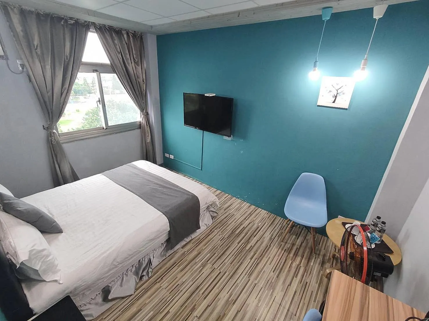 Photo of the whole room, Bed in Light Shadow