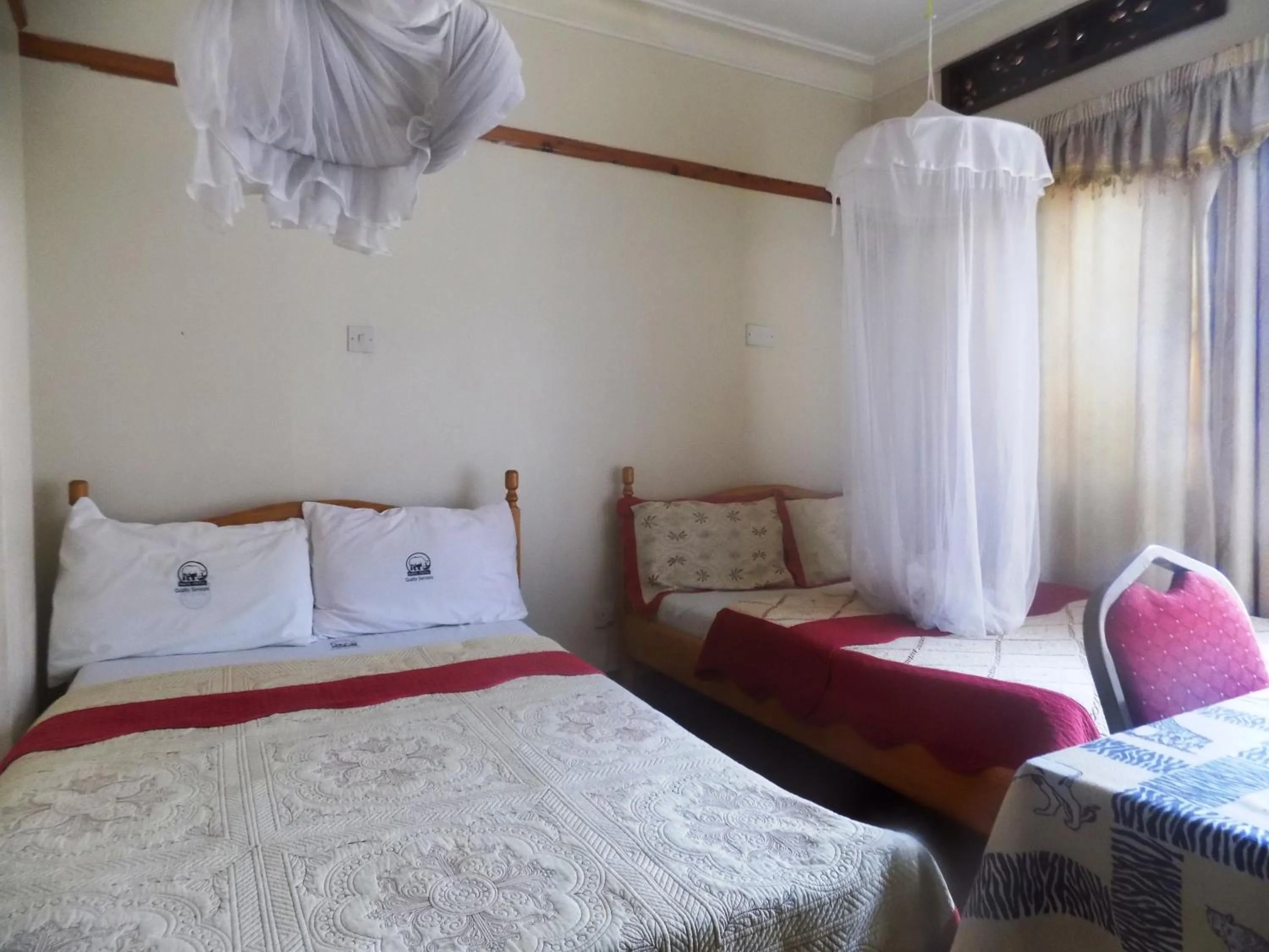 Bed in Rhino Motel Mbarara