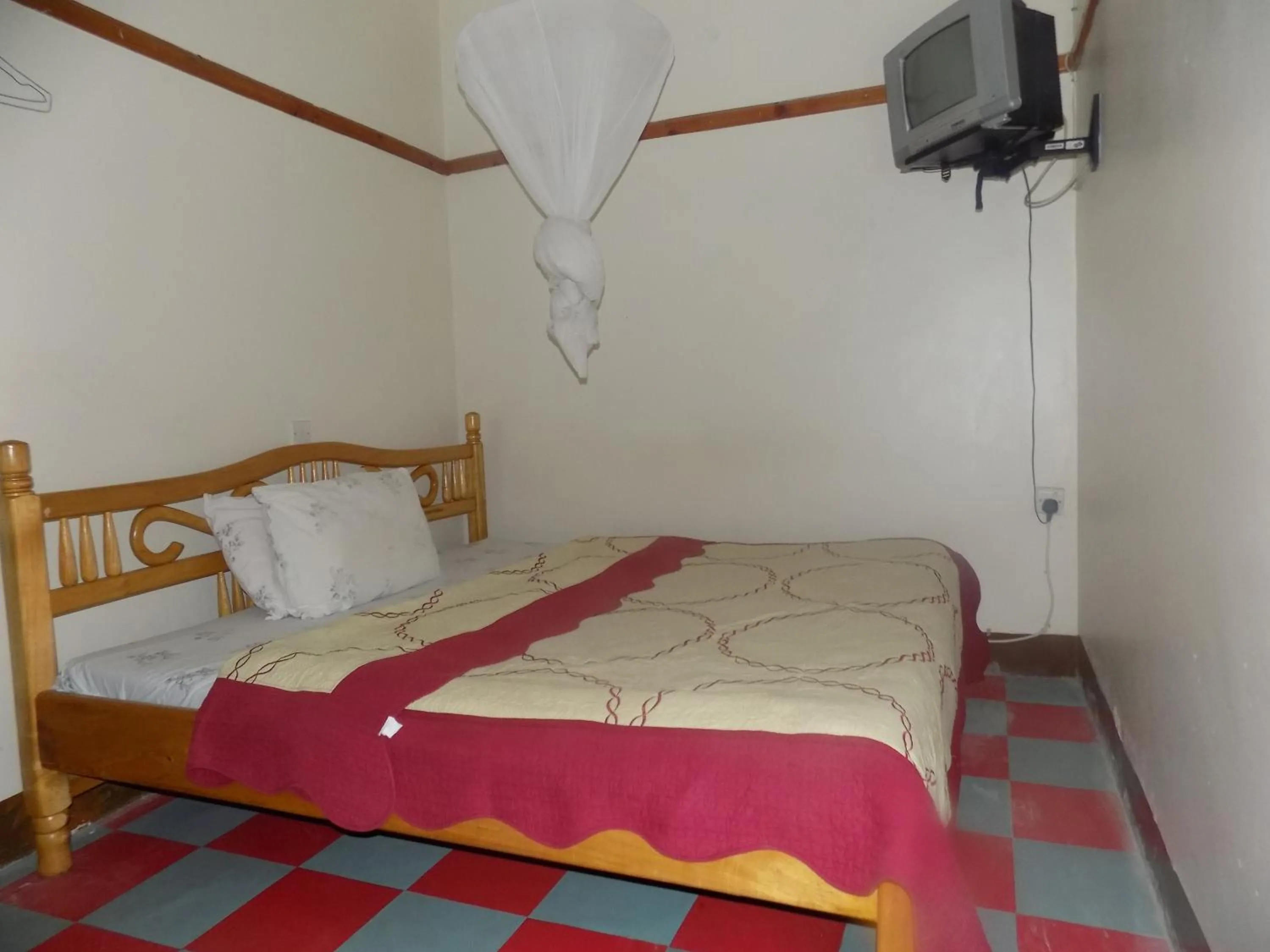 Bed in Rhino Motel Mbarara