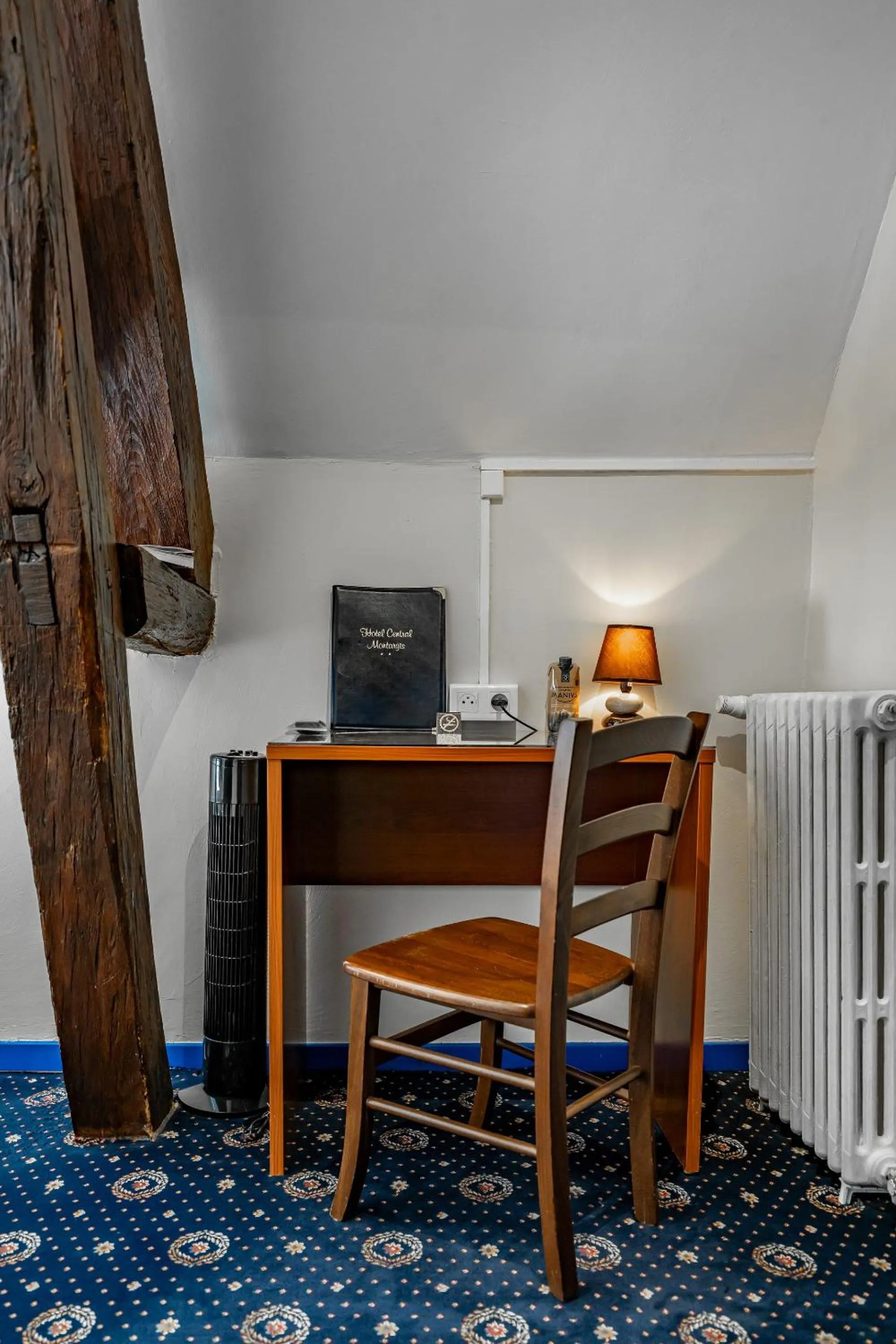 Seating area in Logis Hôtel Central
