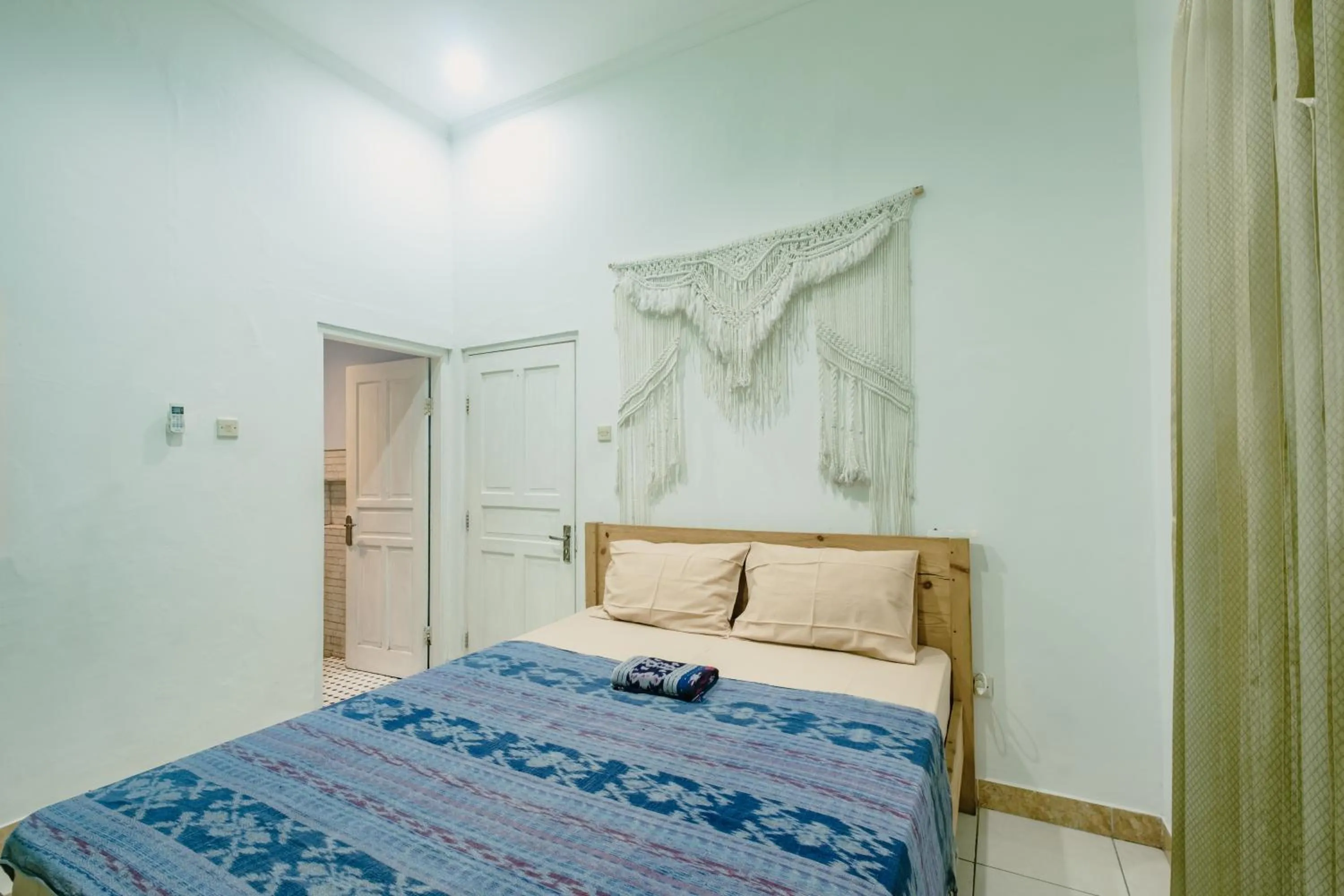 air conditioner, Bed in Happy Buddha Yogyakarta