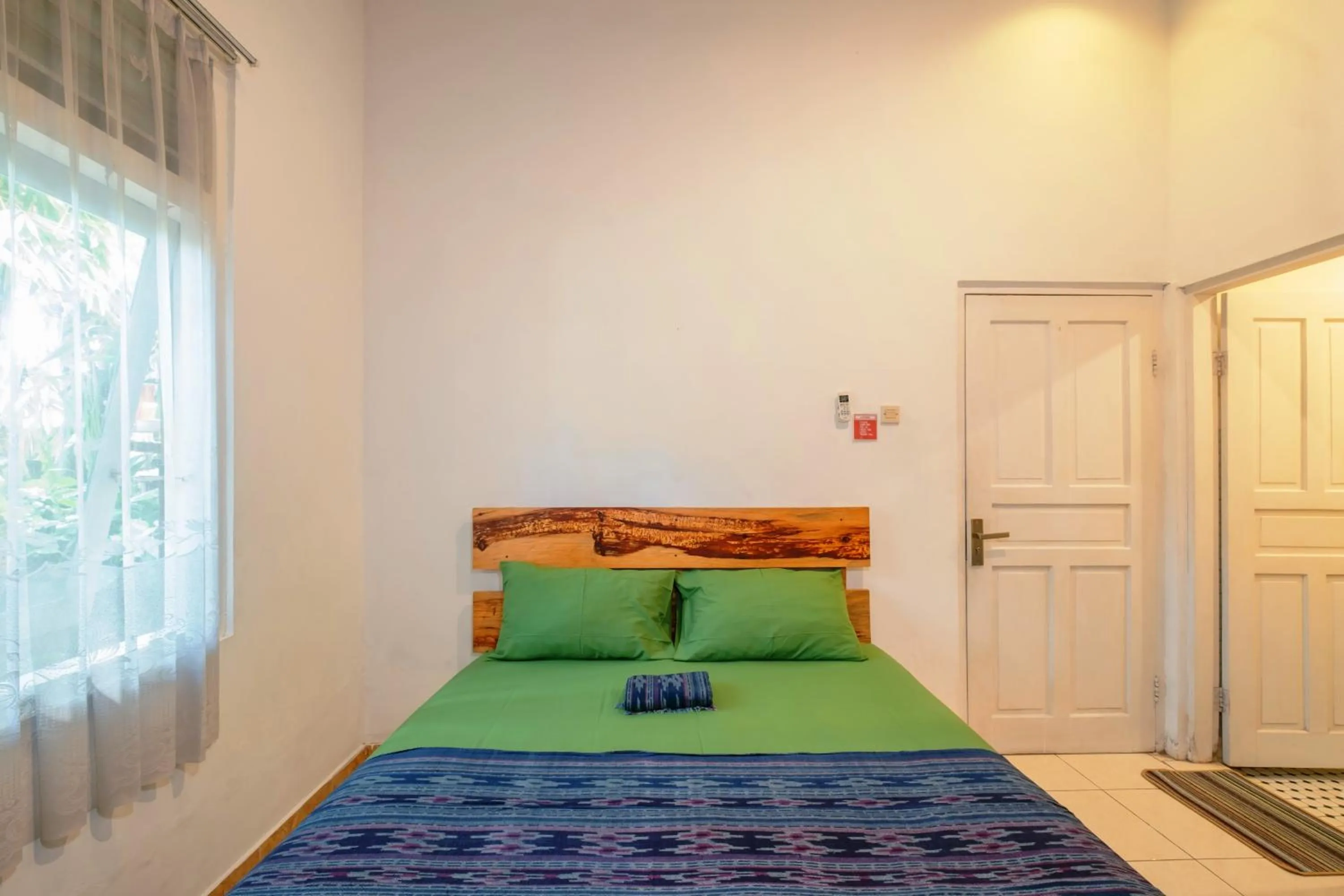 air conditioner, Bed in Happy Buddha Yogyakarta