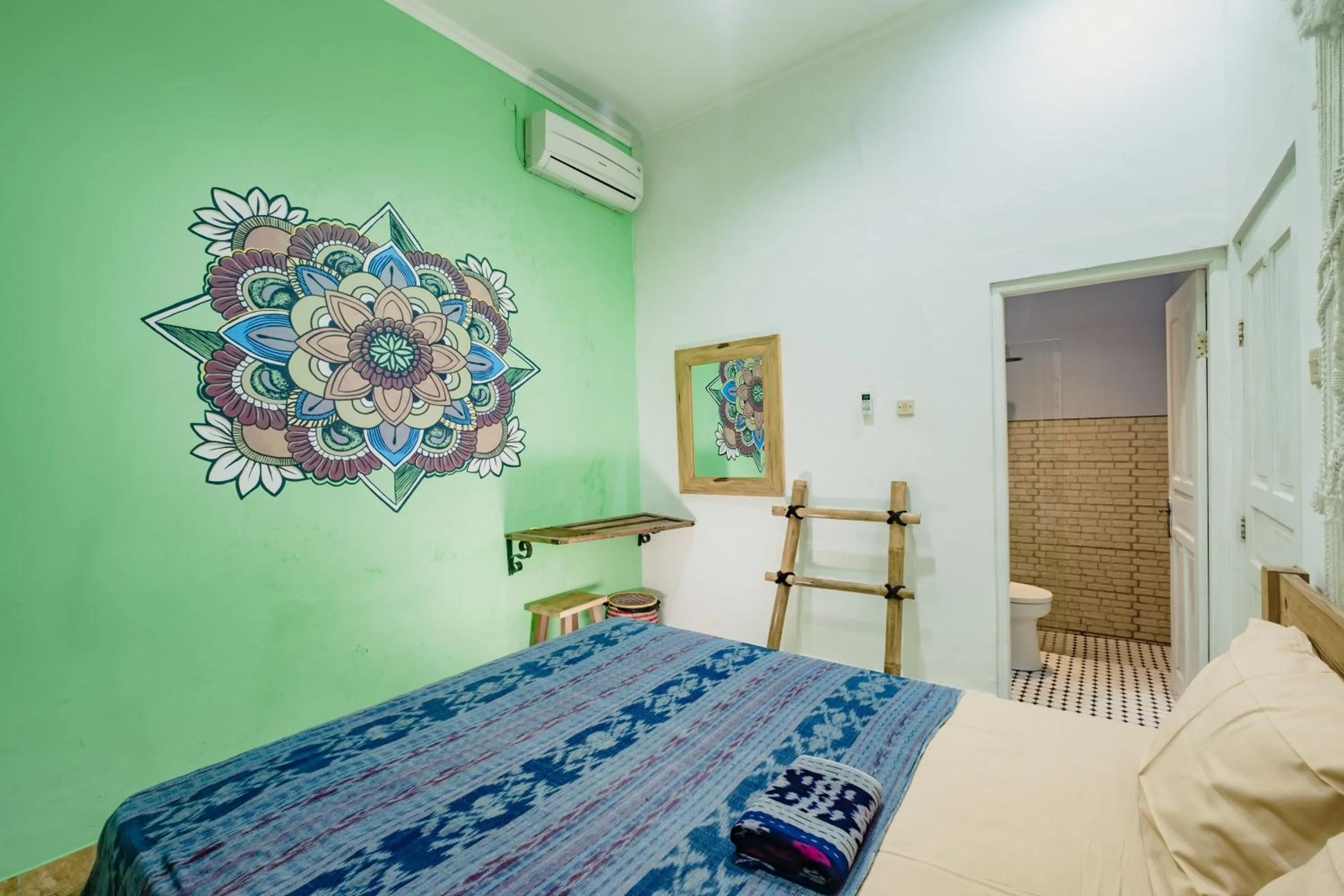 air conditioner, Bed in Happy Buddha Yogyakarta