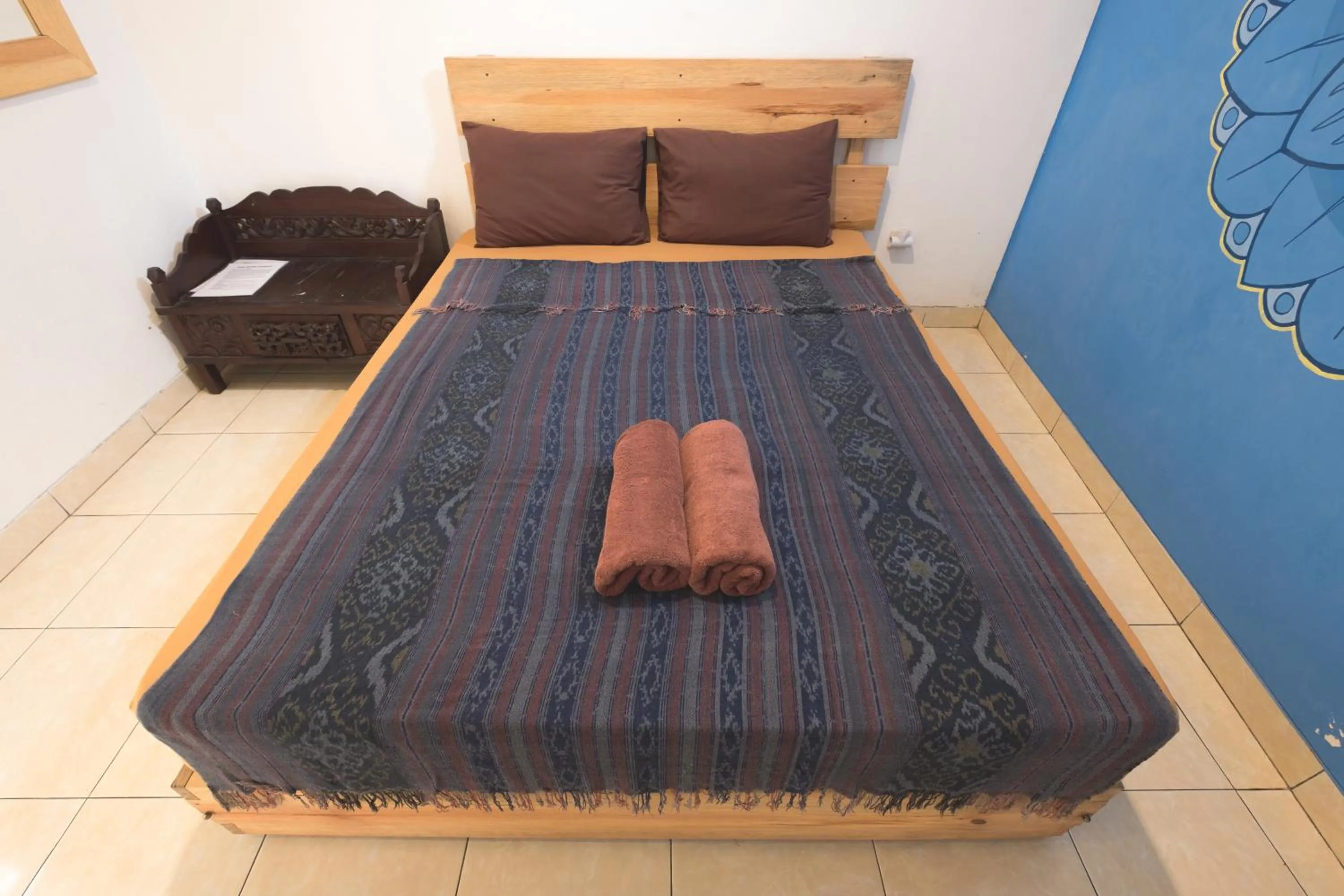 Bed in Happy Buddha Yogyakarta