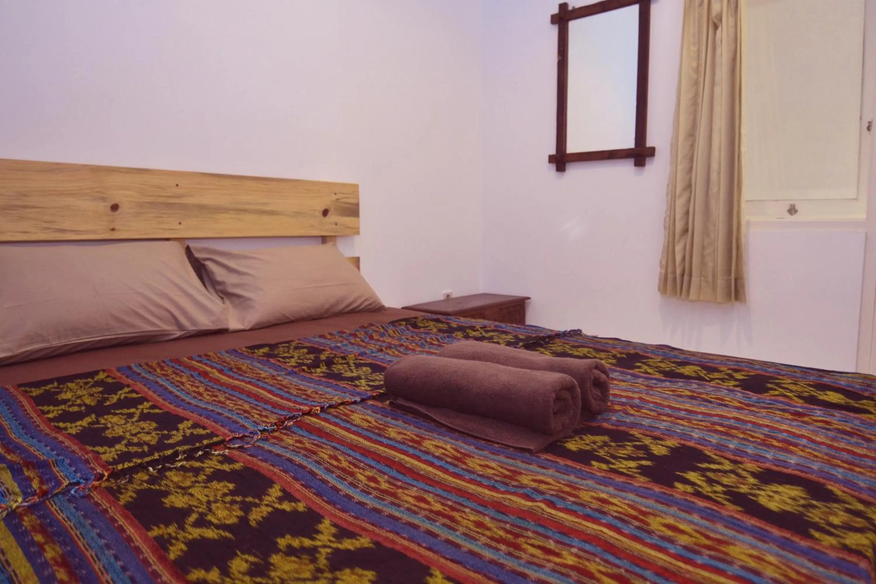 Bed in Happy Buddha Yogyakarta