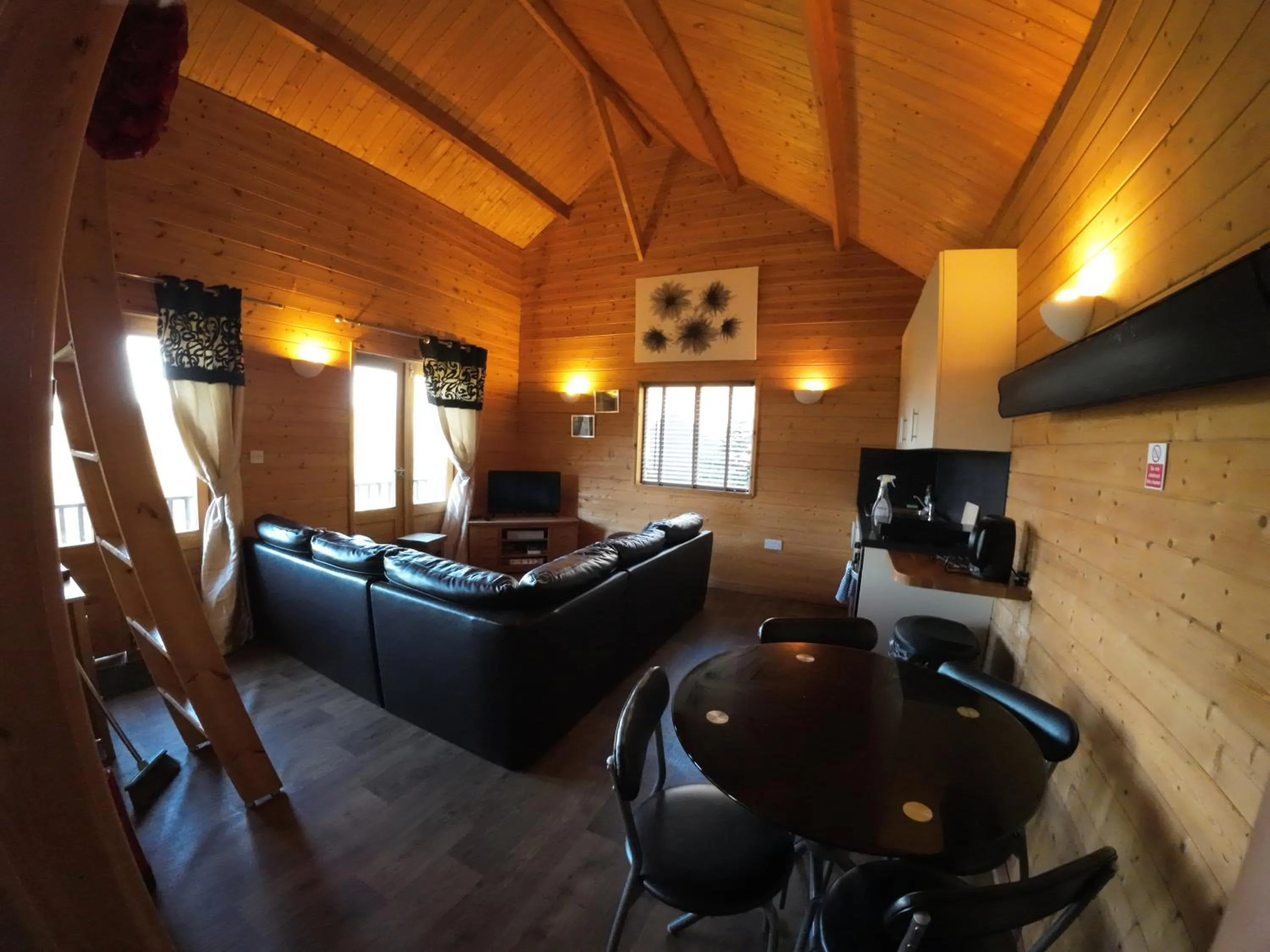 Communal lounge/ TV room in Ironbridge Lodge