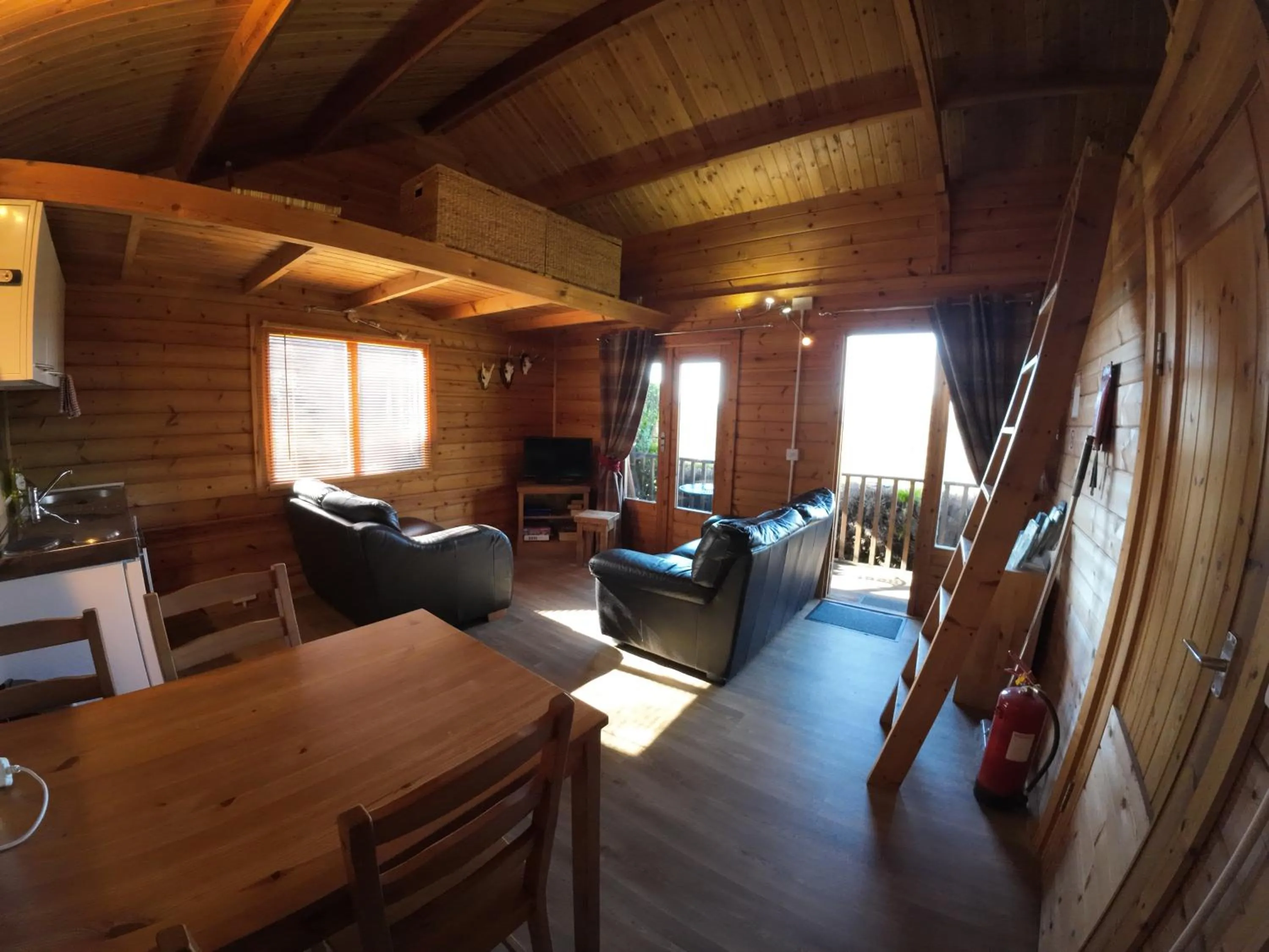 Communal lounge/ TV room in Ironbridge Lodge