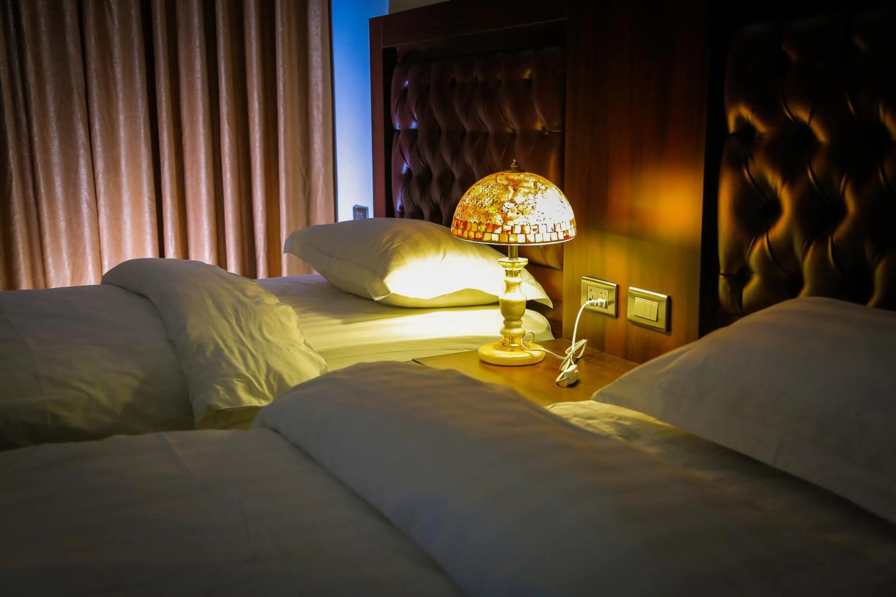 Bed in Qaser Al-Sultan Hotel Suites