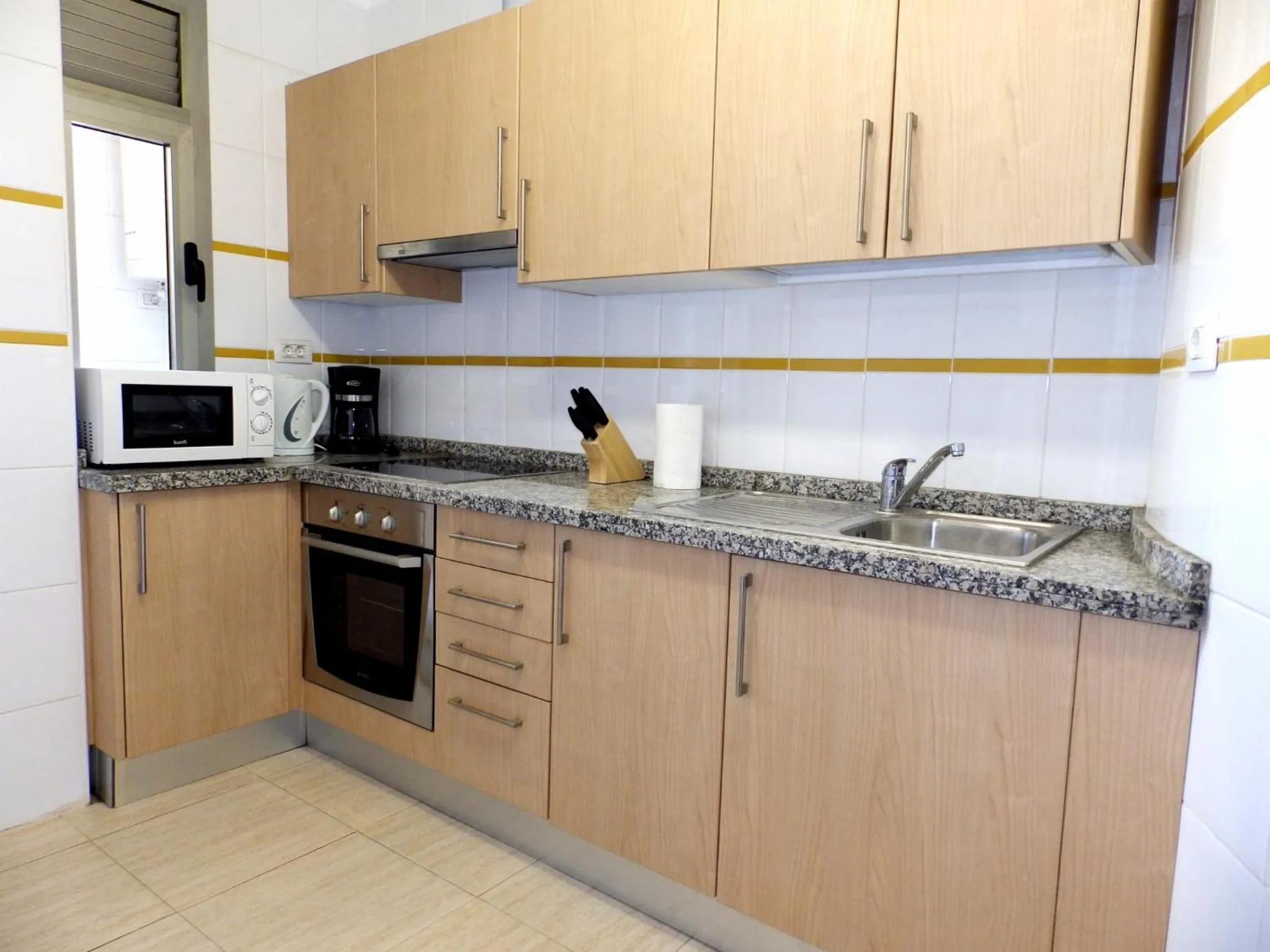 Kitchen or kitchenette in Apartamentos Medano - Oeste