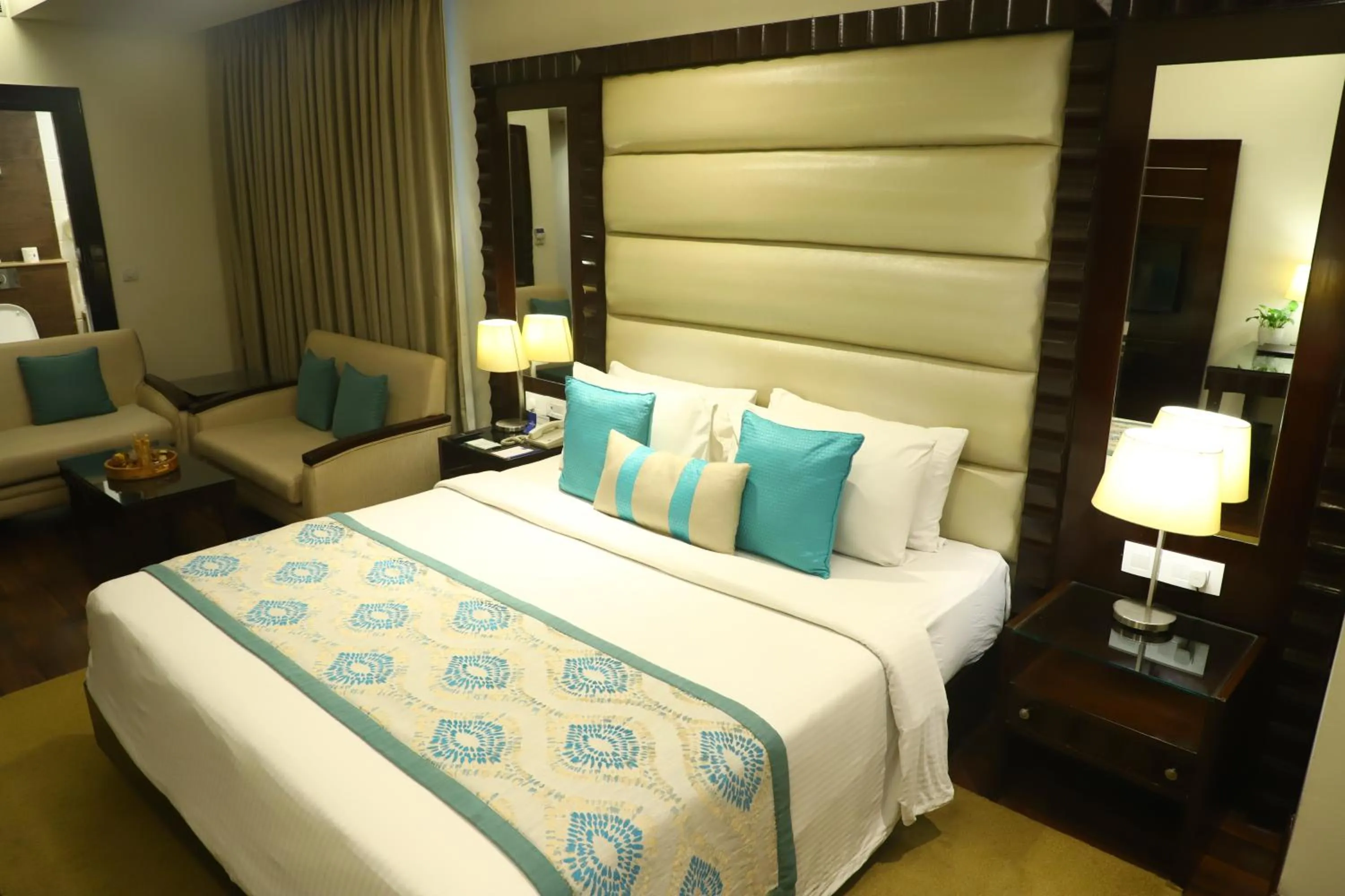 Bed in Deventure Sarovar Portico Kapashera, New Delhi