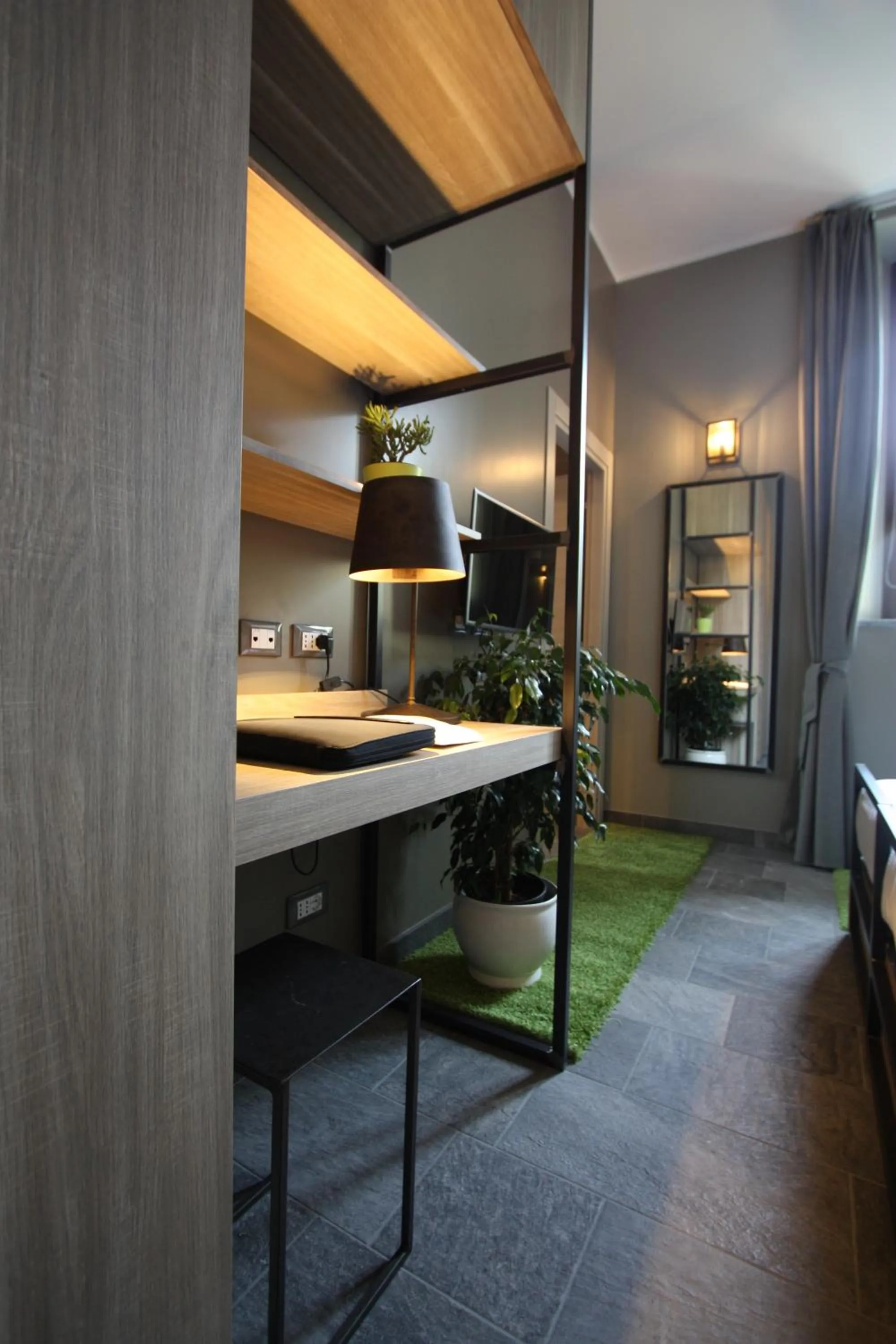 Photo of the whole room in VERSOVERDE HOTEL Alzaia Naviglio Grande