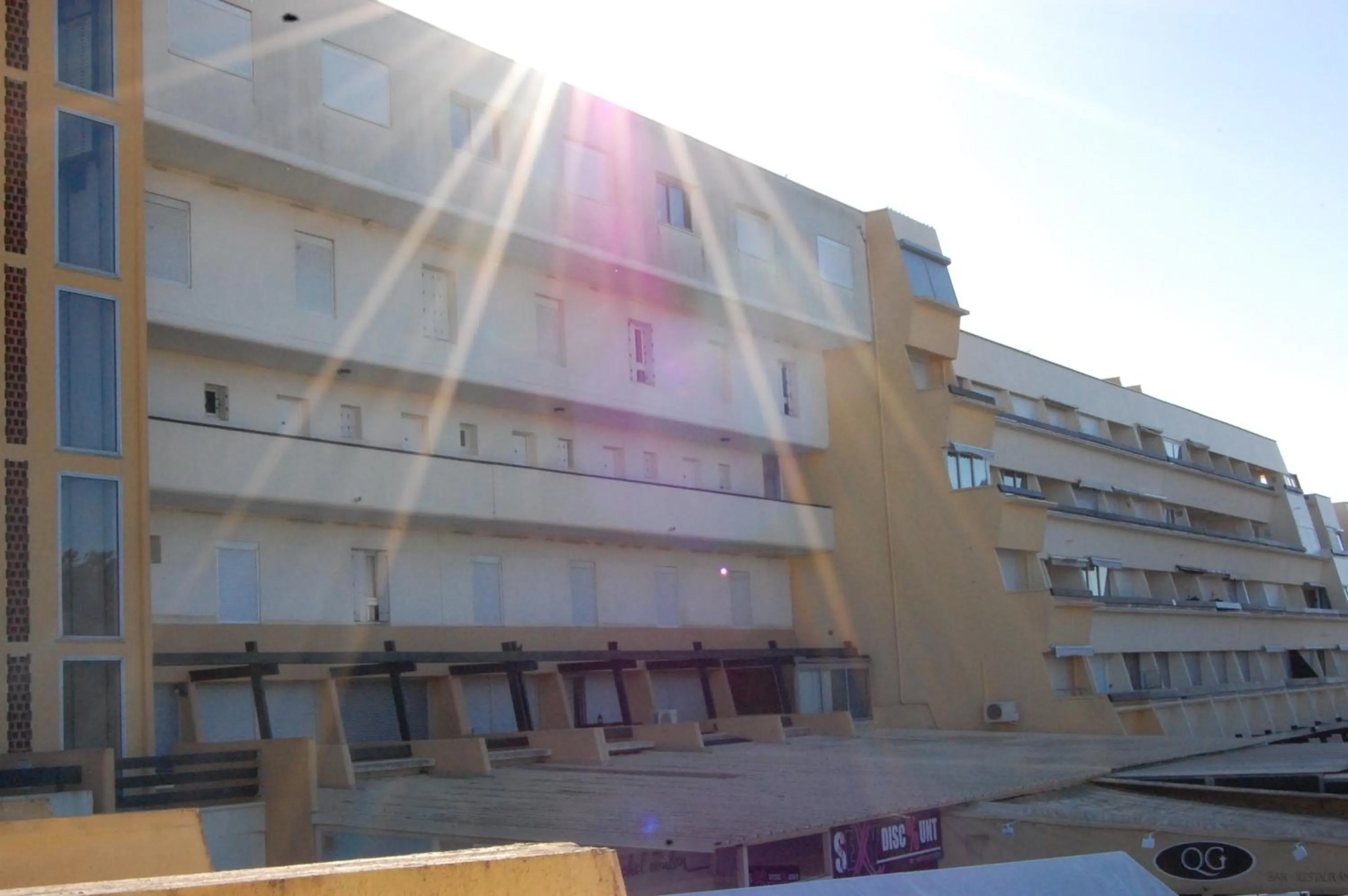 Property building in Au Coeur du Village Naturiste