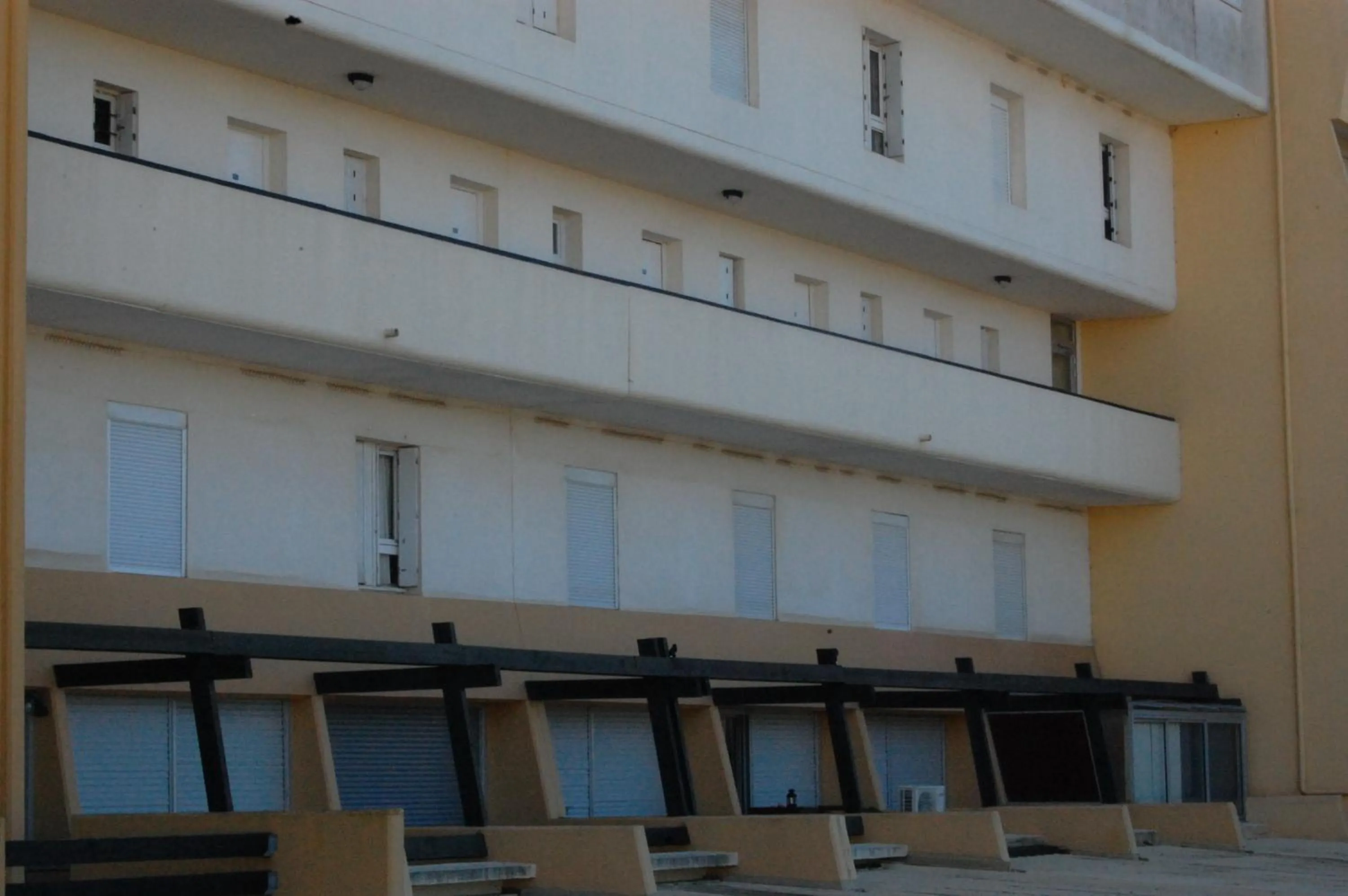 Property building in Au Coeur du Village Naturiste