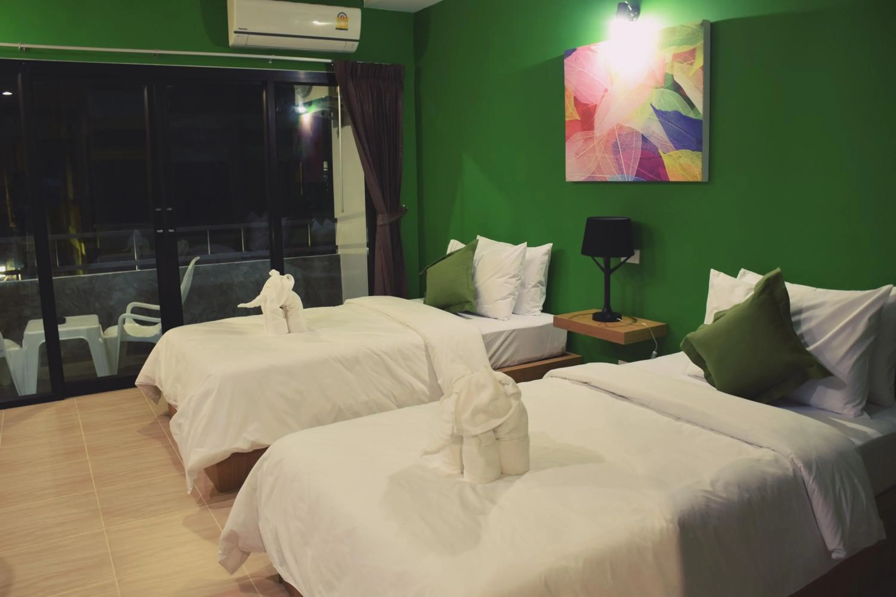 Photo of the whole room, Bed in At Home Khaolak