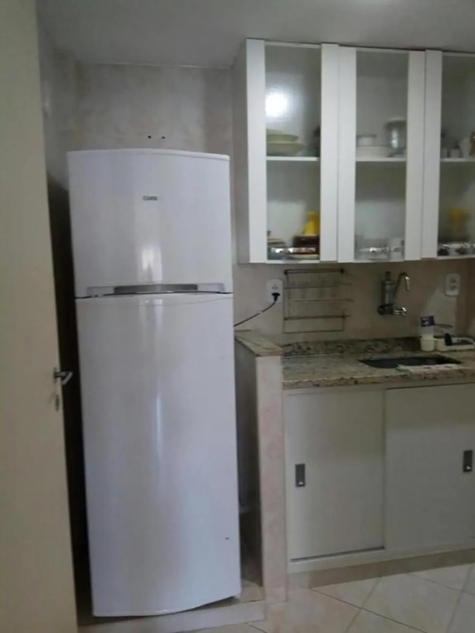 Communal kitchen in Apto Temporada Cabo Frio