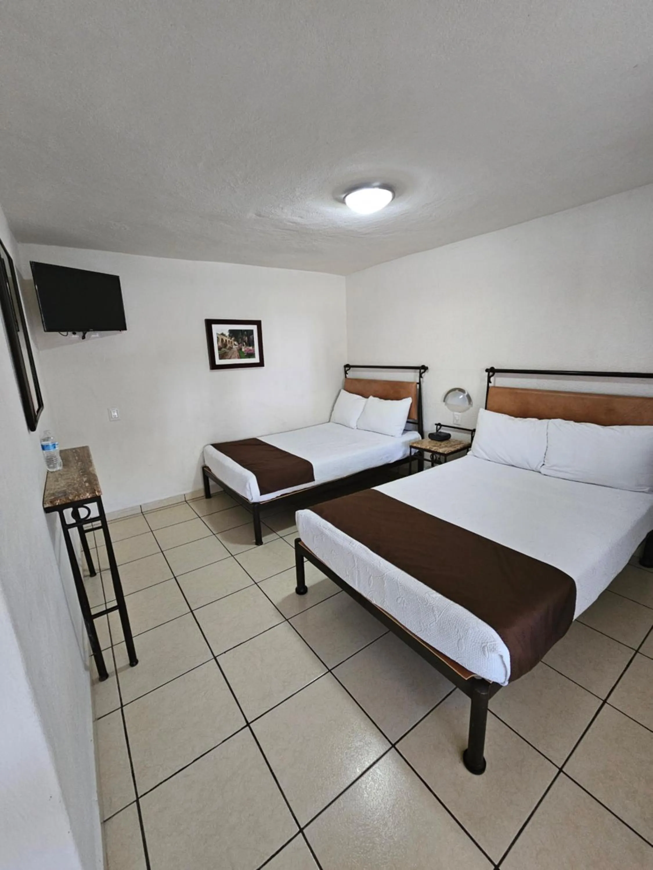 Bed in Hotel Ejecutivo Aeropuerto