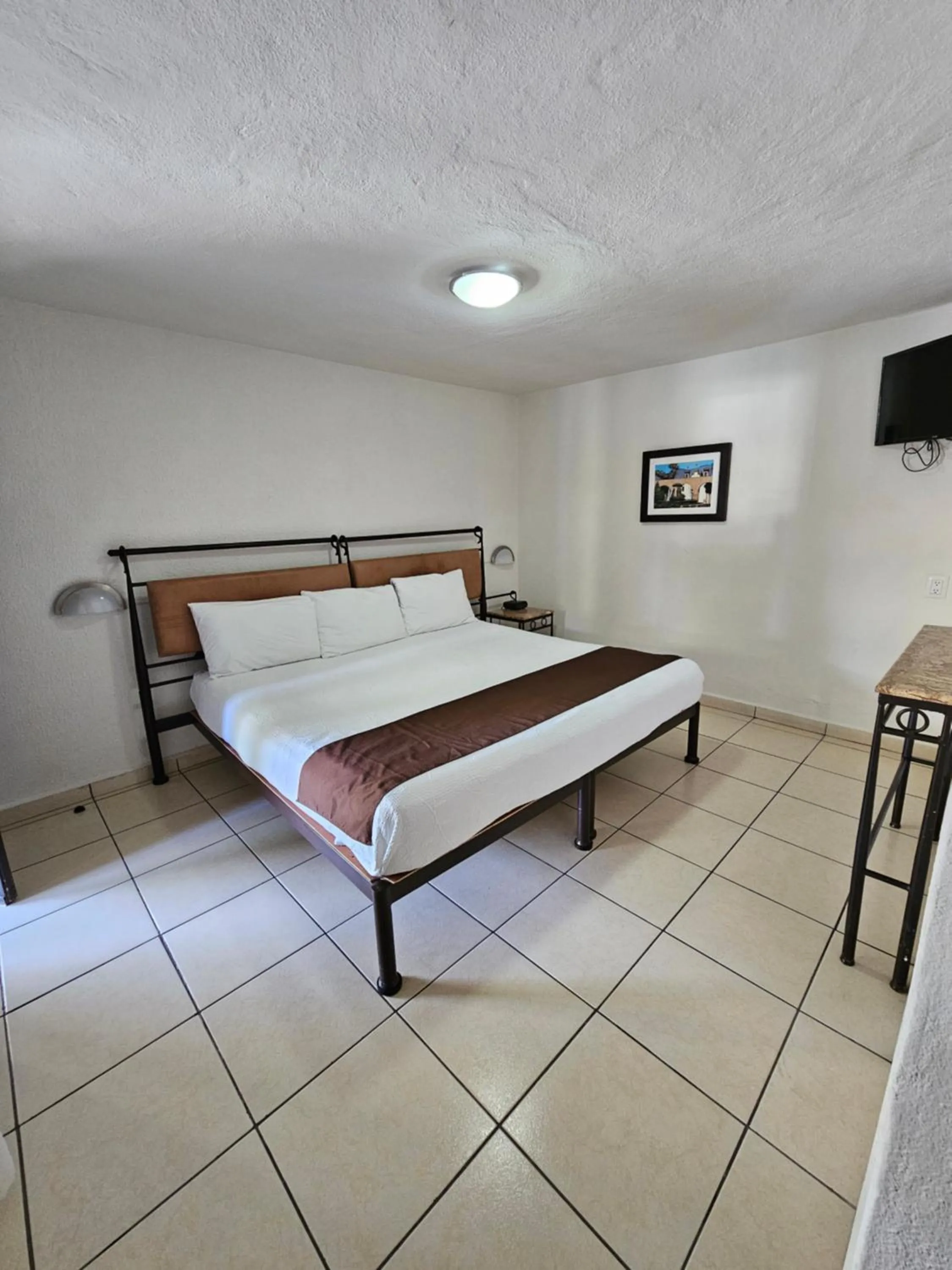 Bed in Hotel Ejecutivo Aeropuerto