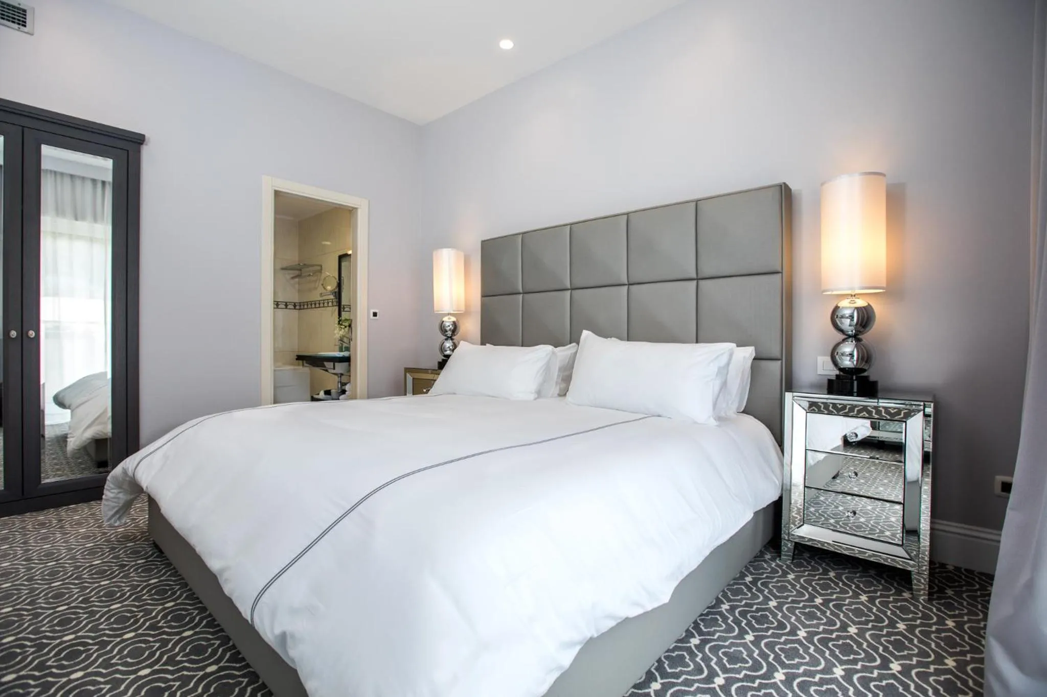 Bed in Royal Ariston Hotel