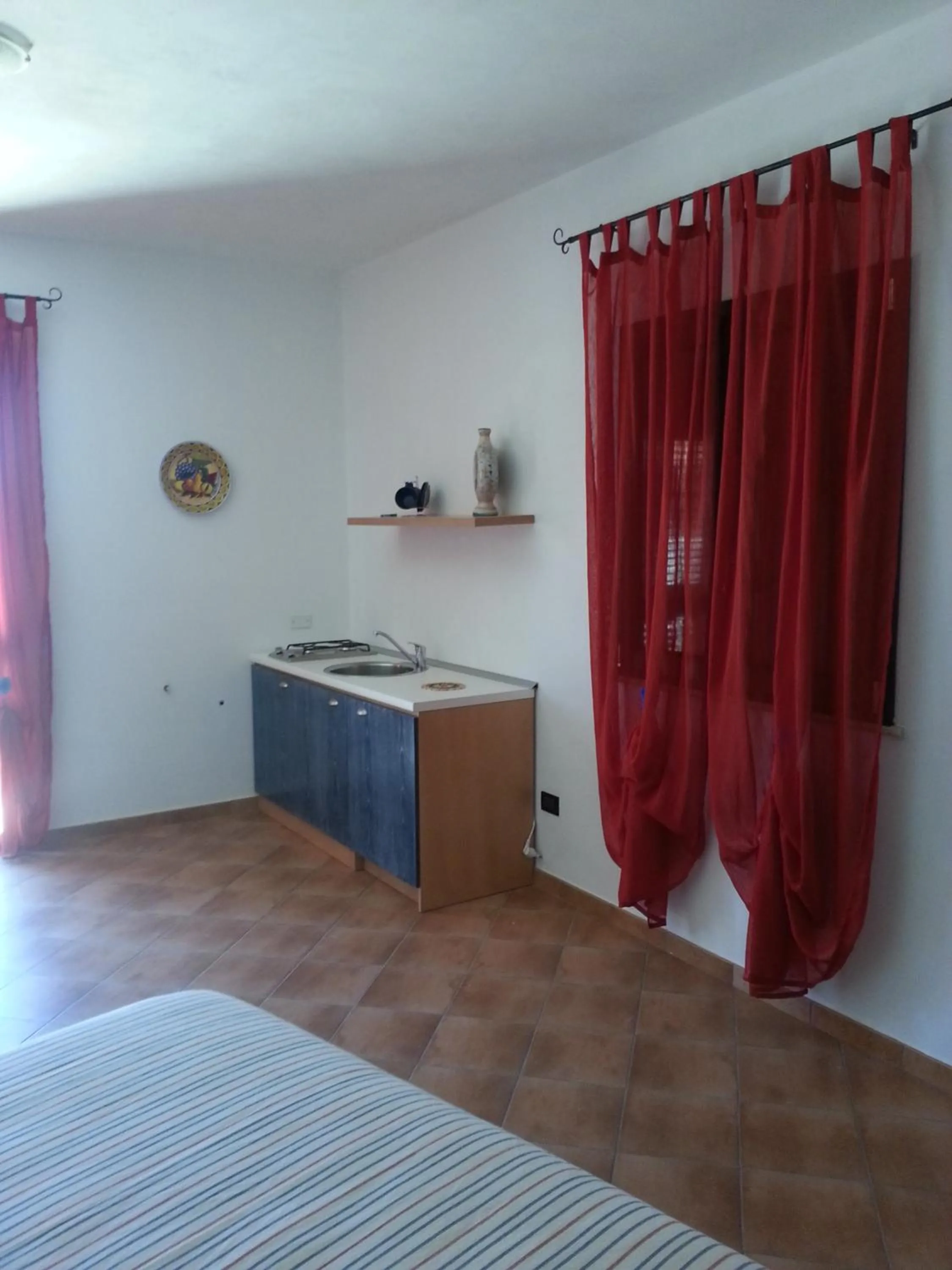Kitchen or kitchenette, Bed in La Casetta di Sara