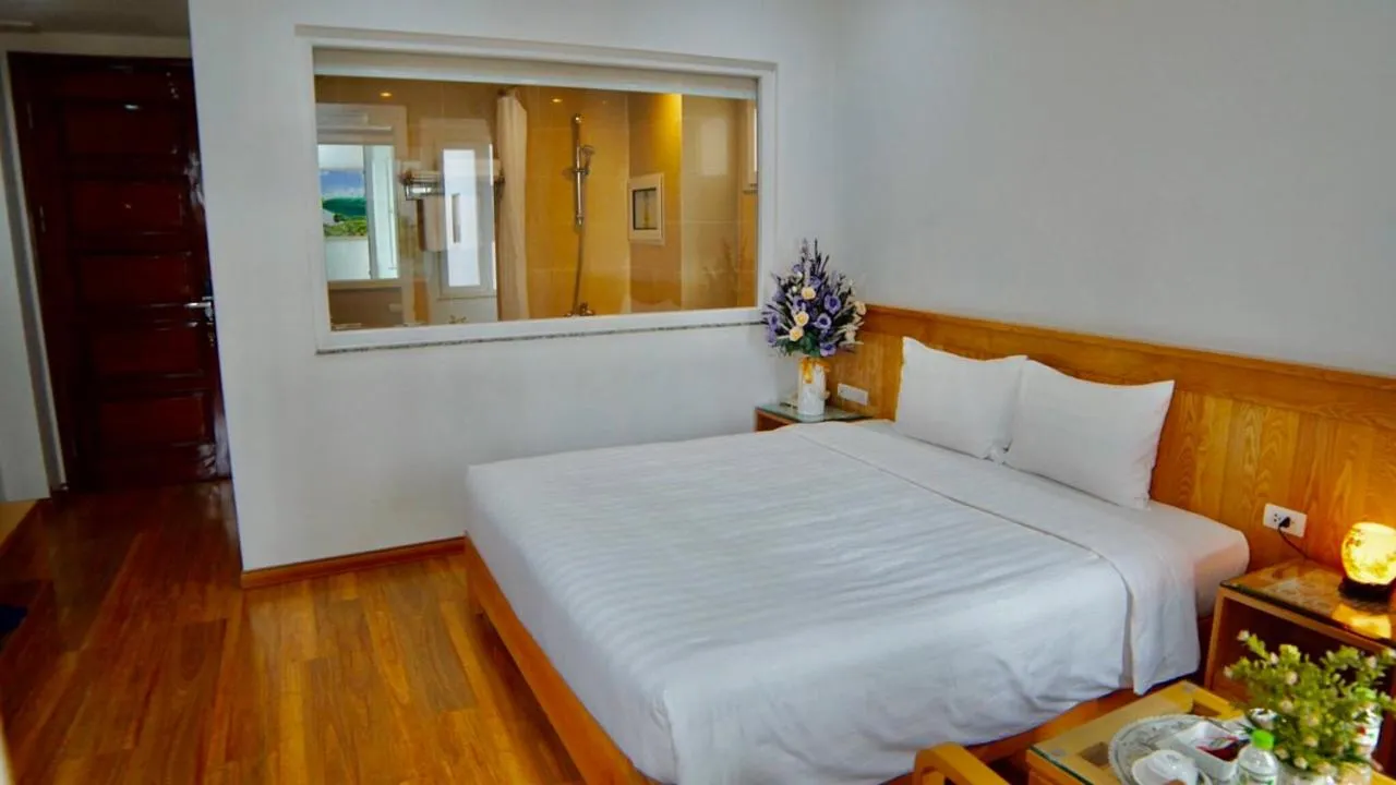 Bed in Blue Hanoi Hotel