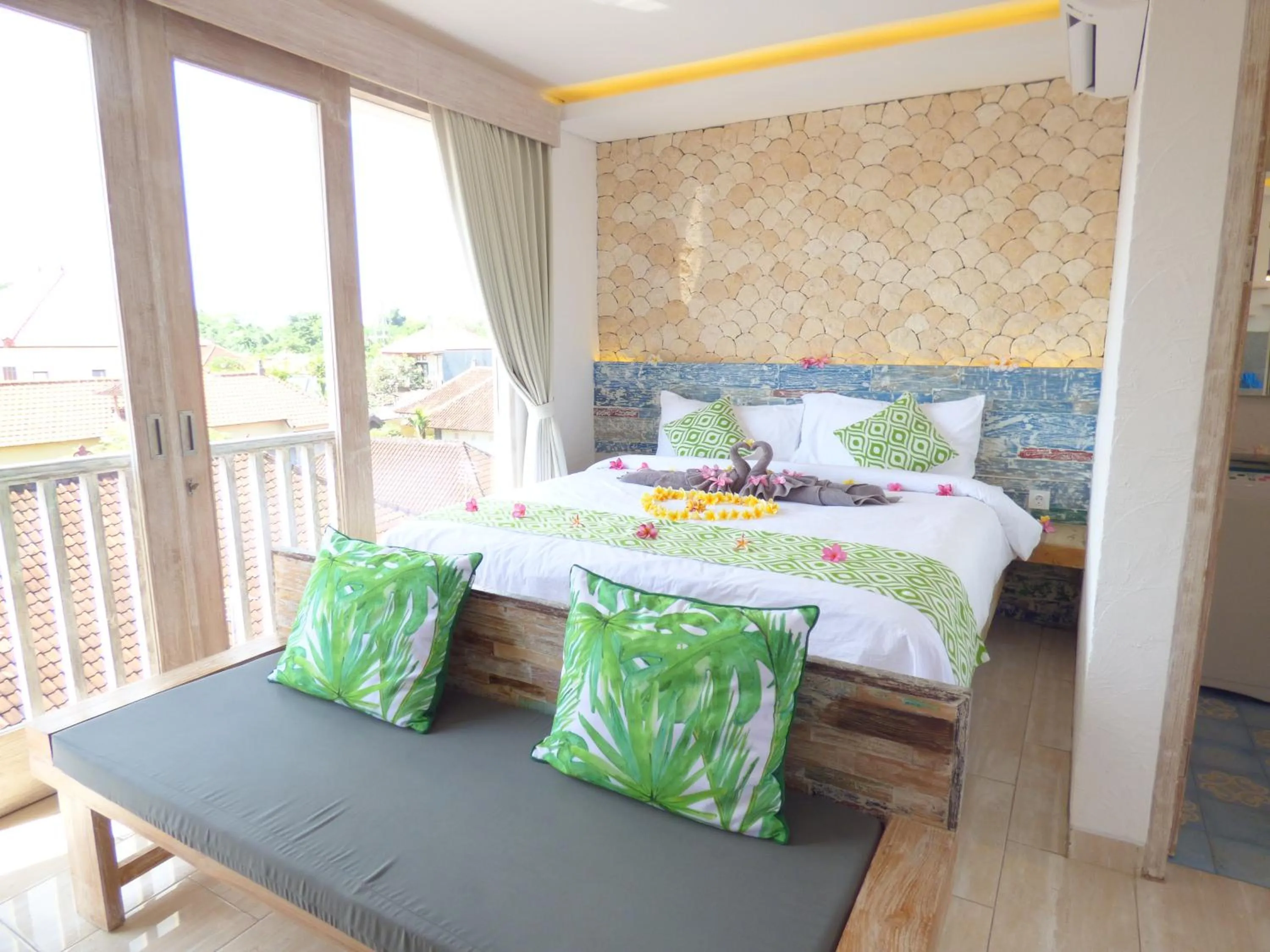 Bed in Green Studio Apartment Sanur