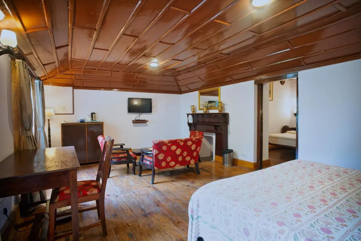 Seating area, Bed in The Hive Cottage By Royal Collection Hotels Seating area, Bed in The Hive Cottage By Royal Collection Hotels