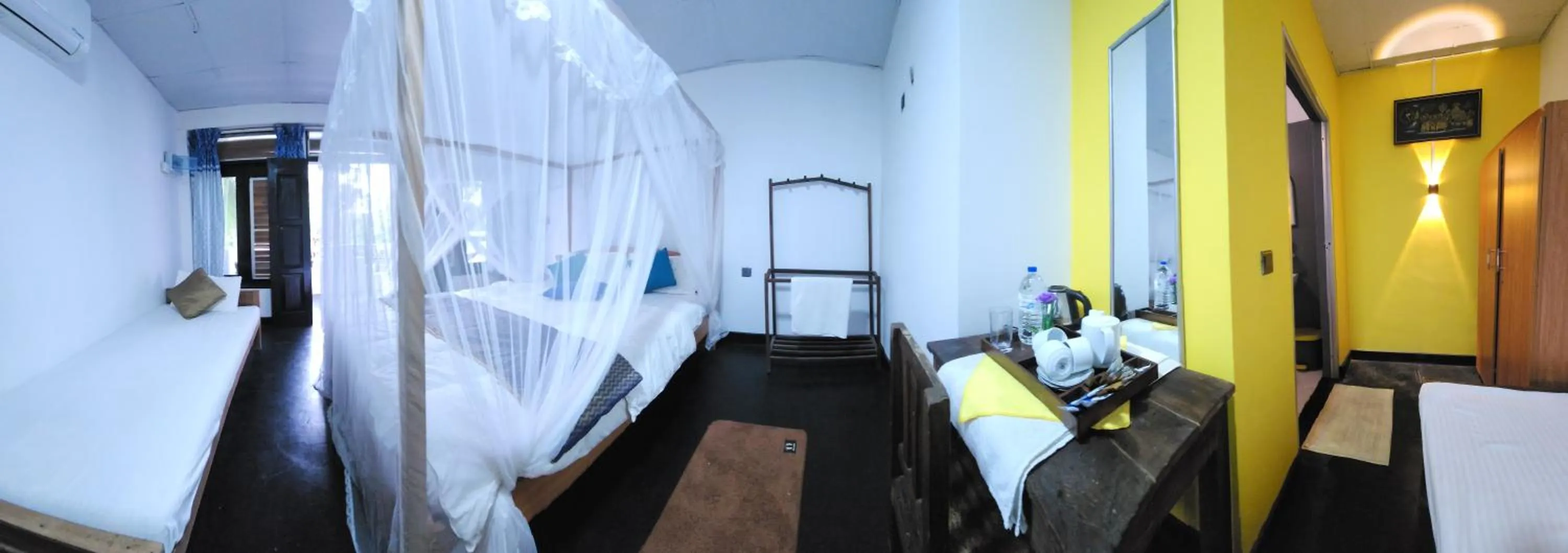 Bed in Dinuda Lagoon Hotel