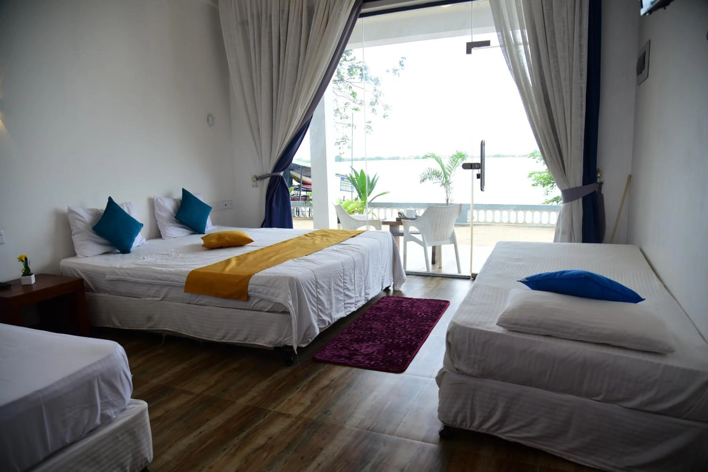 Bed in Dinuda Lagoon Hotel