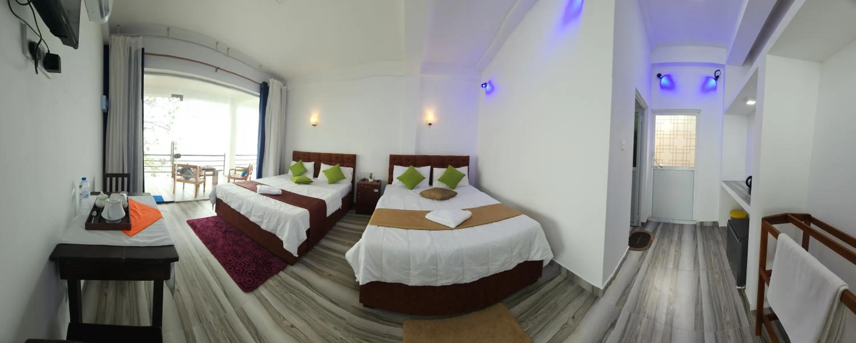 Bed in Dinuda Lagoon Hotel