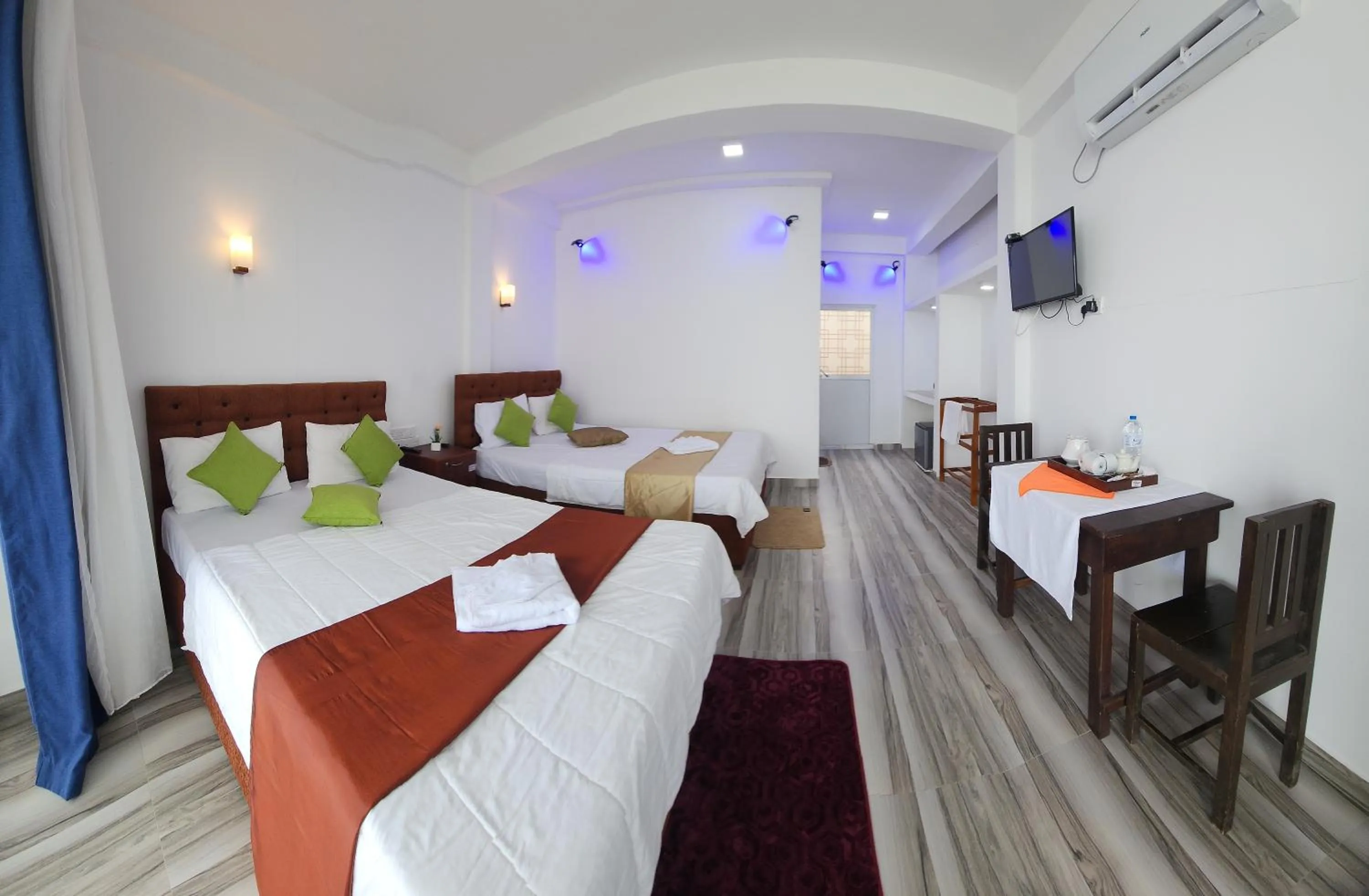 Bed in Dinuda Lagoon Hotel