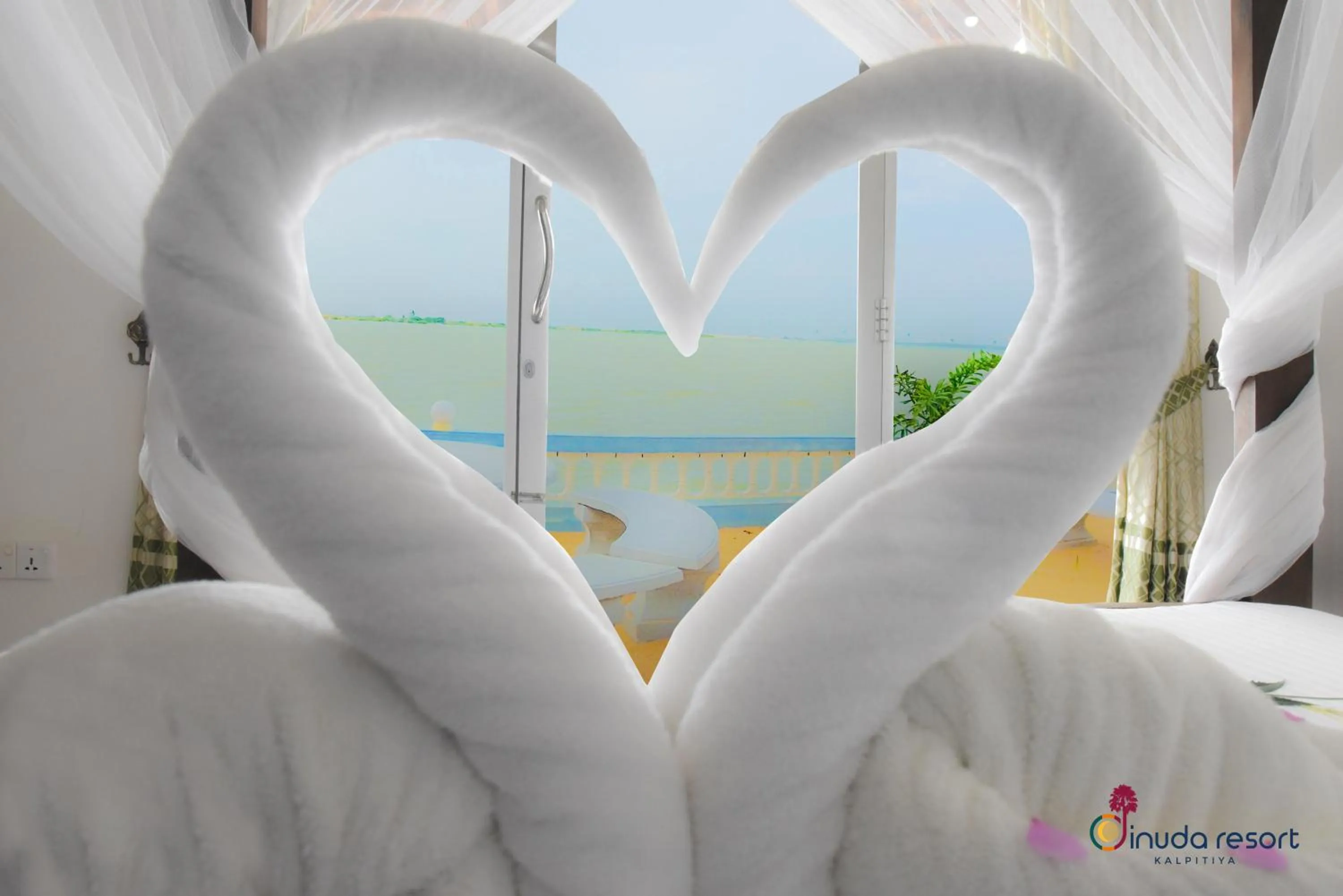 Bed in Dinuda Lagoon Hotel