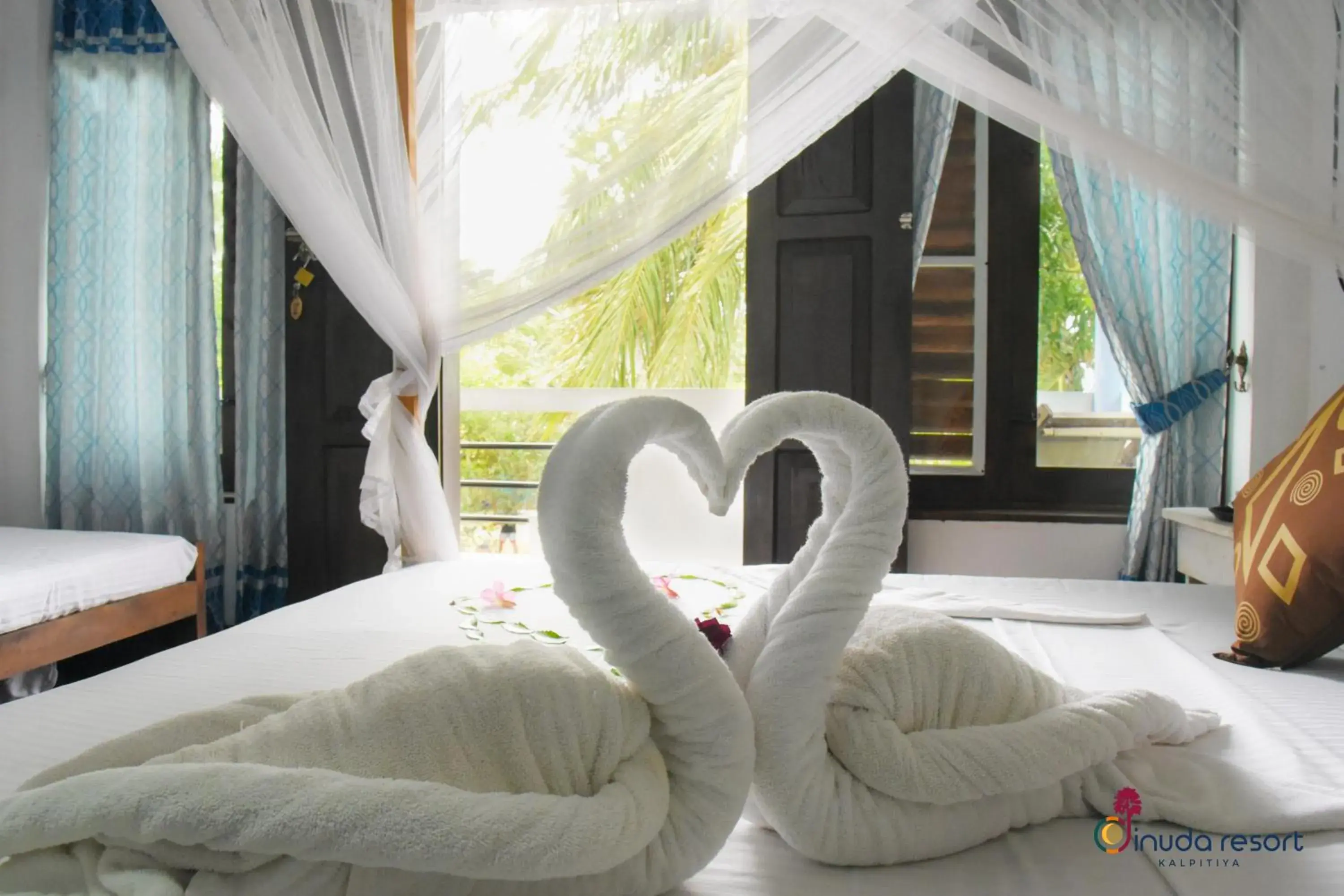 Bed in Dinuda Lagoon Hotel Bed in Dinuda Lagoon Hotel
