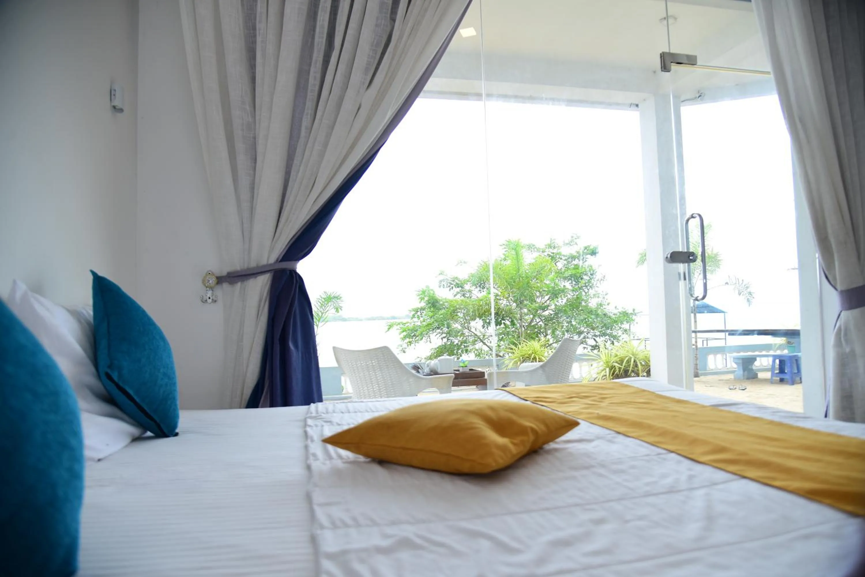 Bed in Dinuda Lagoon Hotel