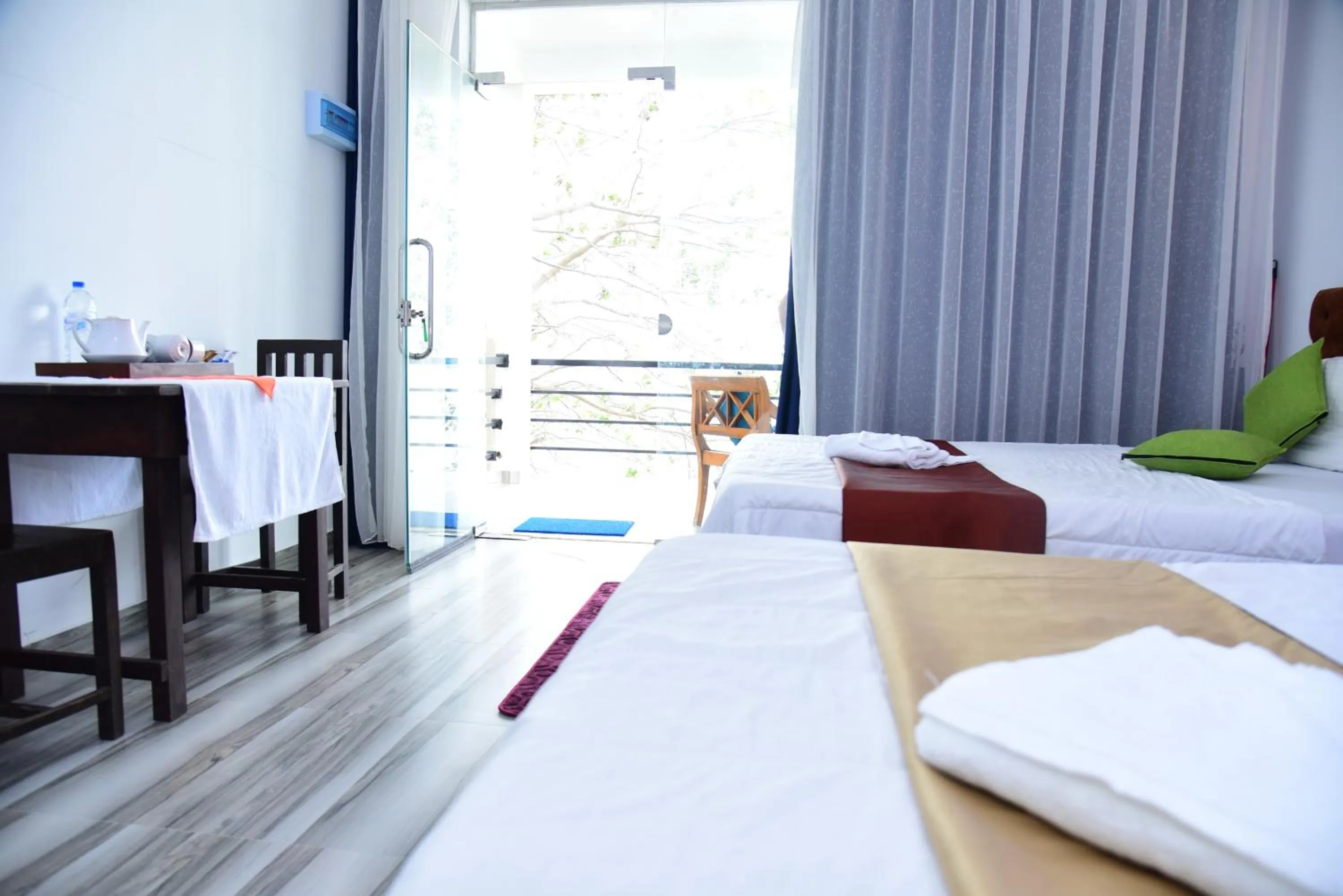 Bed in Dinuda Lagoon Hotel